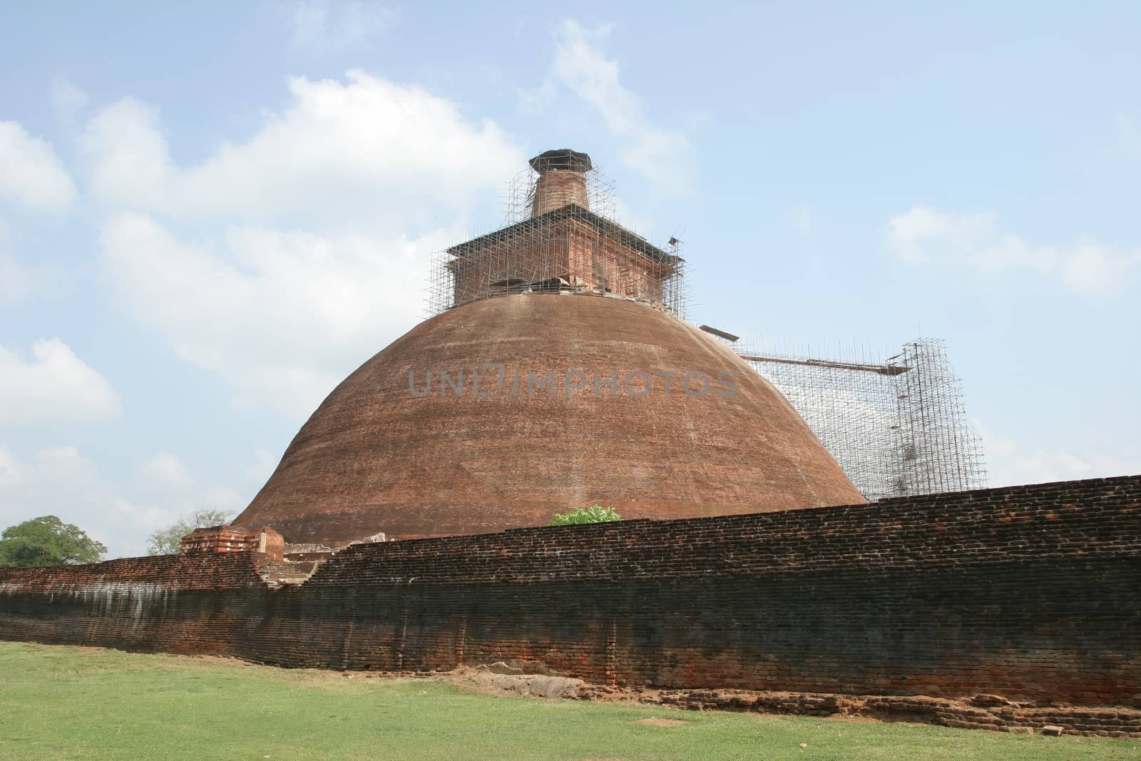 Sri Lanka, Buddhist stupa traditional brick under renovation near Polonnaruwa  by kgboxford