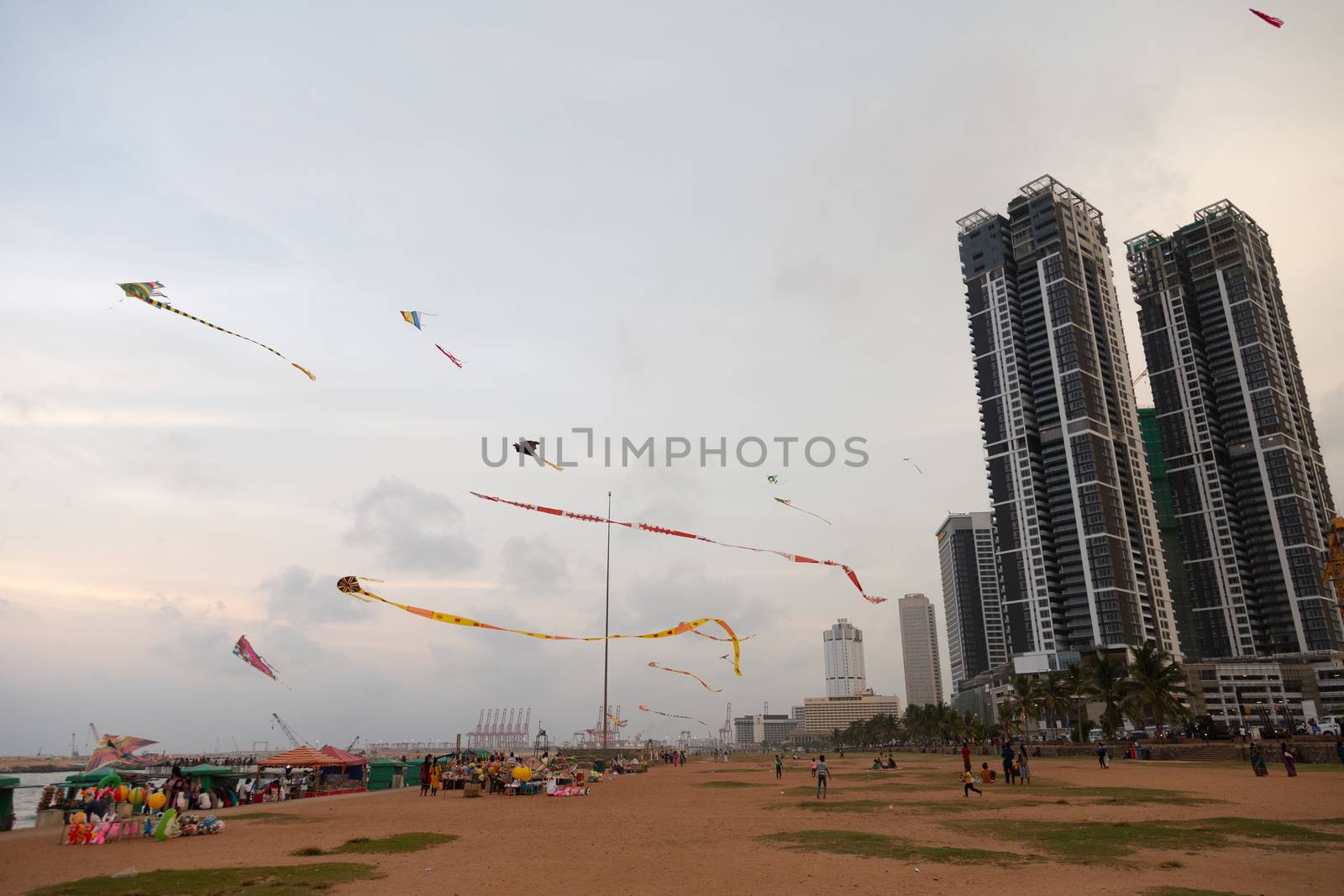 Colombo Sri Lanka 4.25.2018 People flying kites Galle fort road seafront sunset by kgboxford