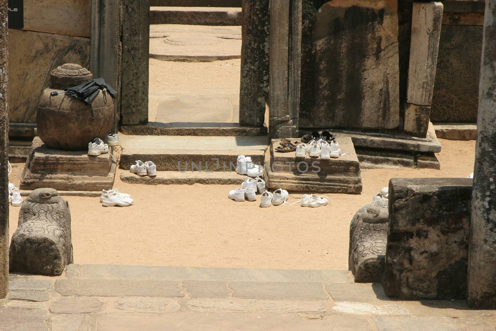 Polonnaruwa Sri Lanka Ancient ruin shoes removed before entering Buddhist shrine by kgboxford