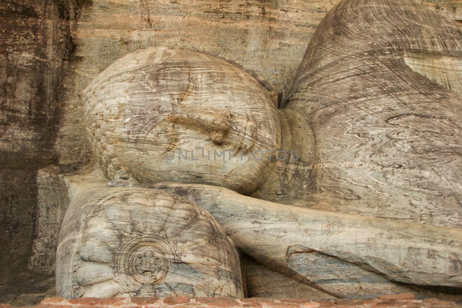 Polonnaruwa Sri Lanka Ancient ruins Statue of reclining Buddha laying down . High quality photo