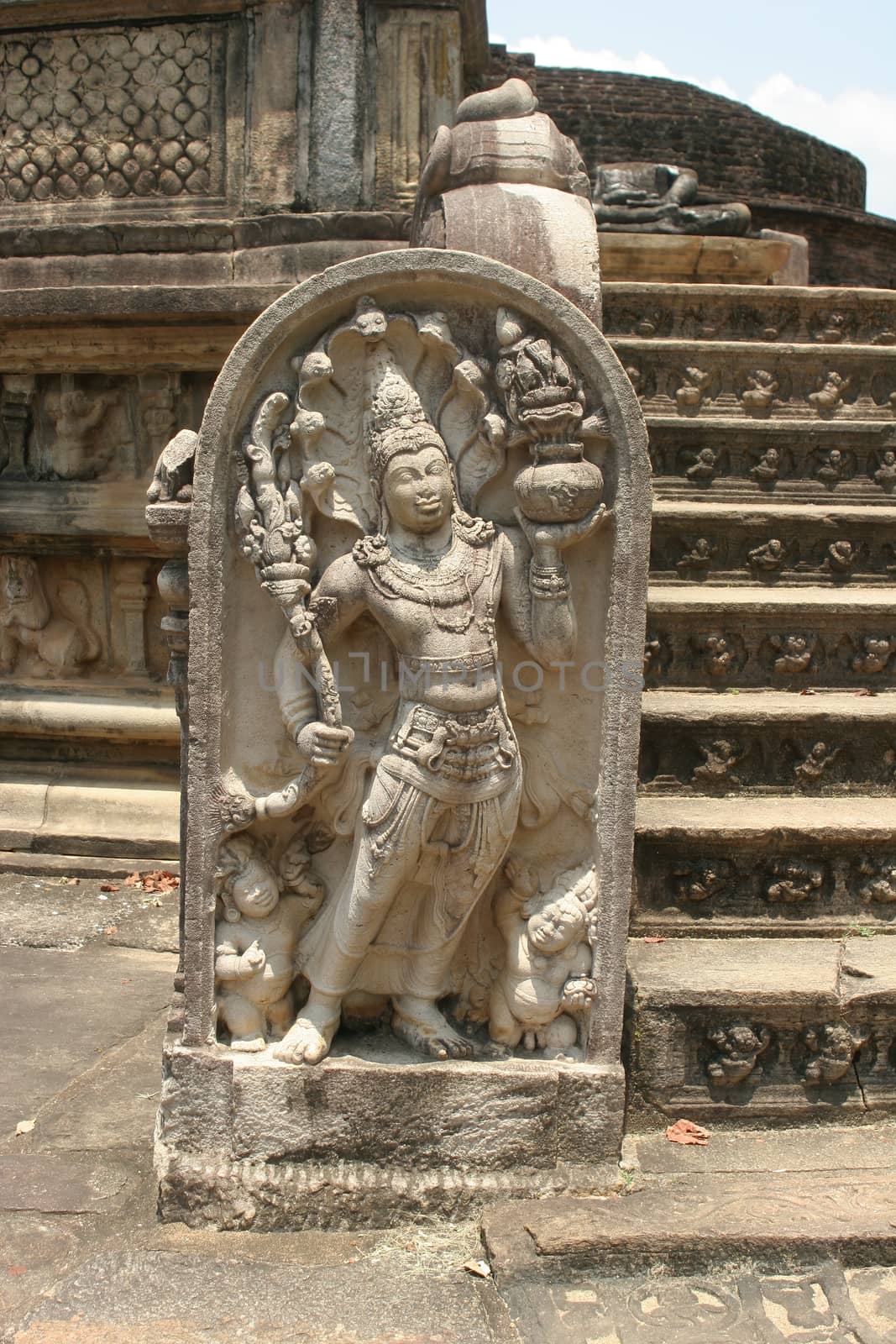 Polonnaruwa Sri Lanka Ancient ruins Statues at entrance to shrine beside stairs . High quality photo