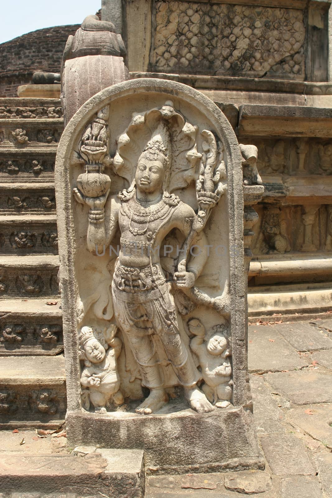 Polonnaruwa Sri Lanka Ancient ruins Statues at entrance to shrine beside stairs . High quality photo