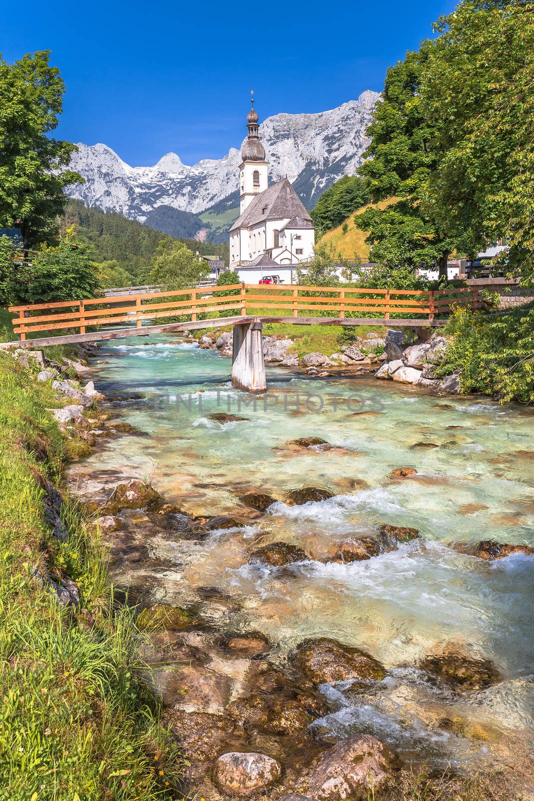 Sankt Sebastian pilgrimage church with alpine turquoise river alpine landscape view, Ramsau, Nationalpark Berchtesgadener Land, Bavaria, Germany