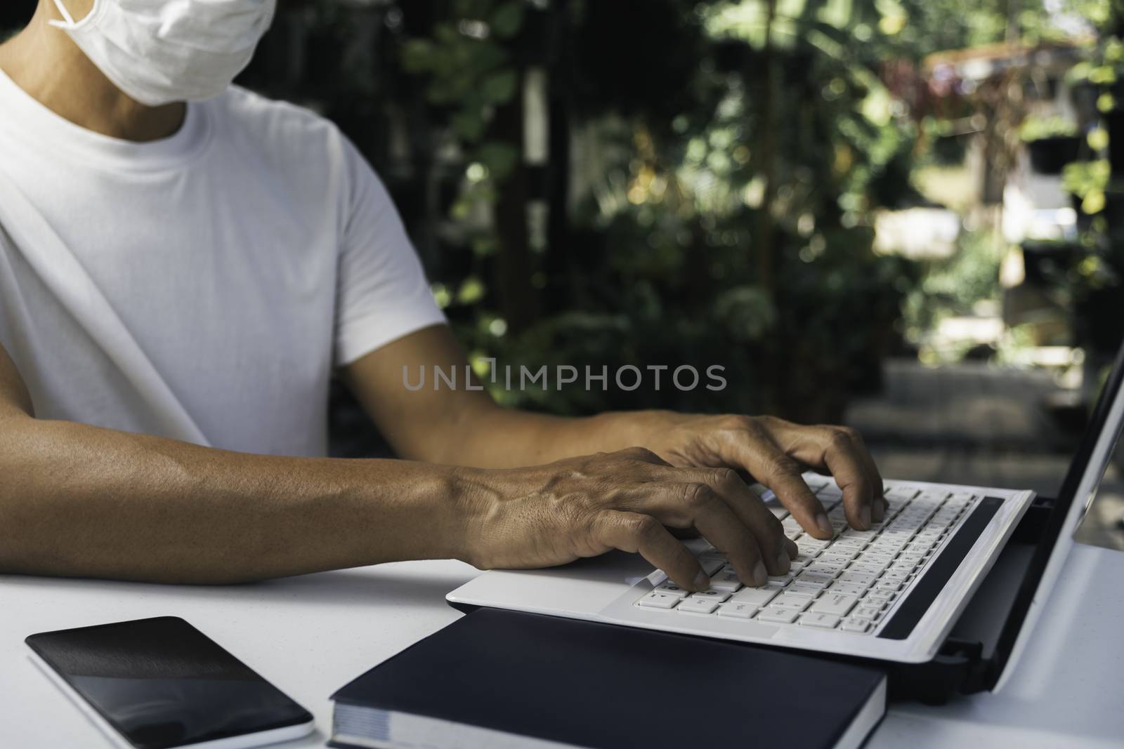 A man working at home and using laptop on the table. Technology  by kirisa99