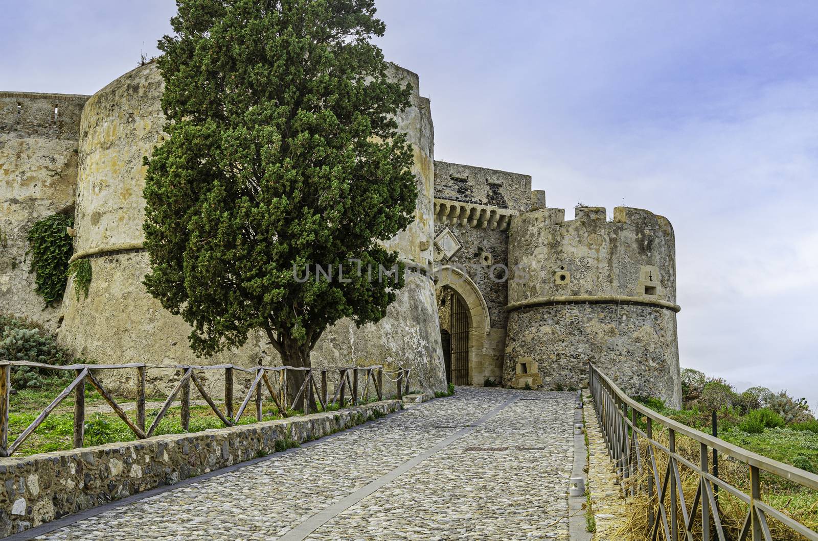 facade and entrance to the medieval castle of milazzo in sicily on the tyrrhenian sea. Italy.