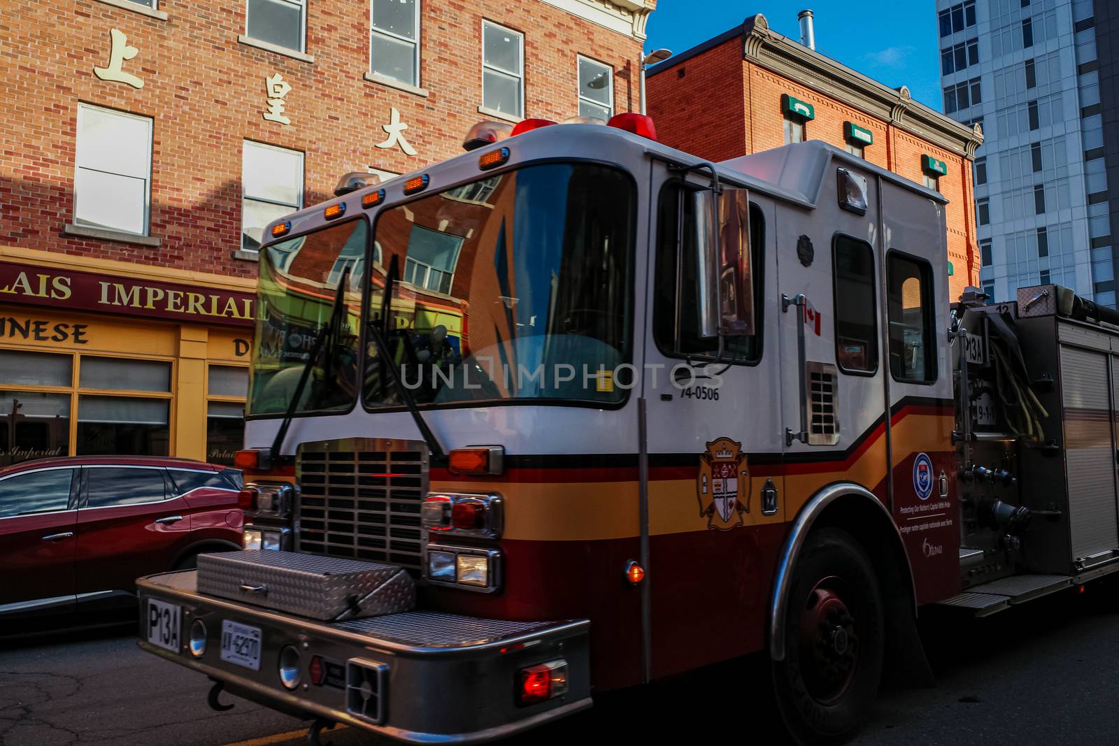 Ottawa, Ontario, Canada - November 18, 2020: An Ottawa Fire Services fire truck rushes down Dalhousie Street in the ByWard Market in response to an emergency call.