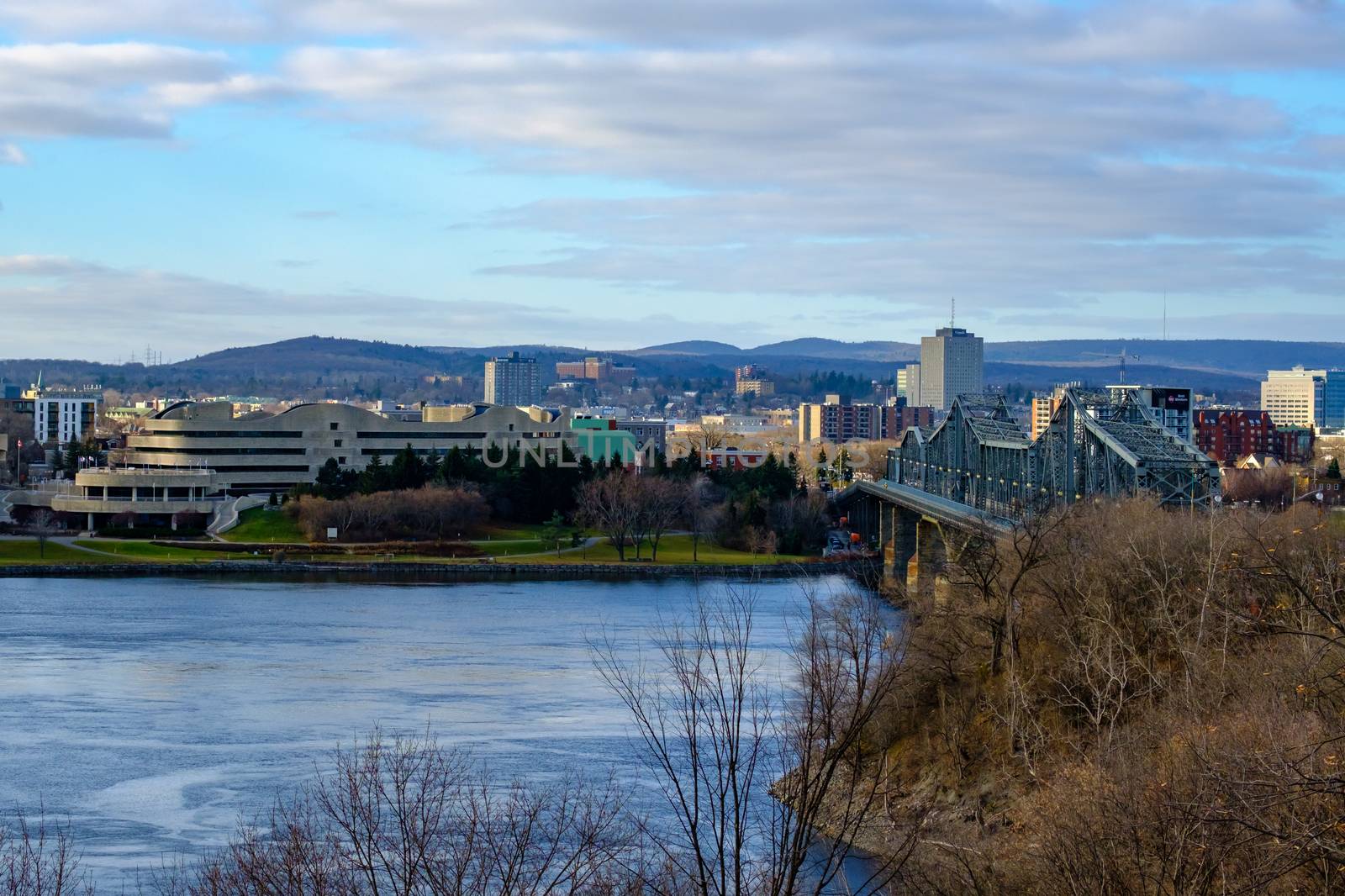 Ottawa, Ontario, Canada - November 18, 2020: Gatineau, Quebec and the Alexandra Bridge from across the Ottawa River.