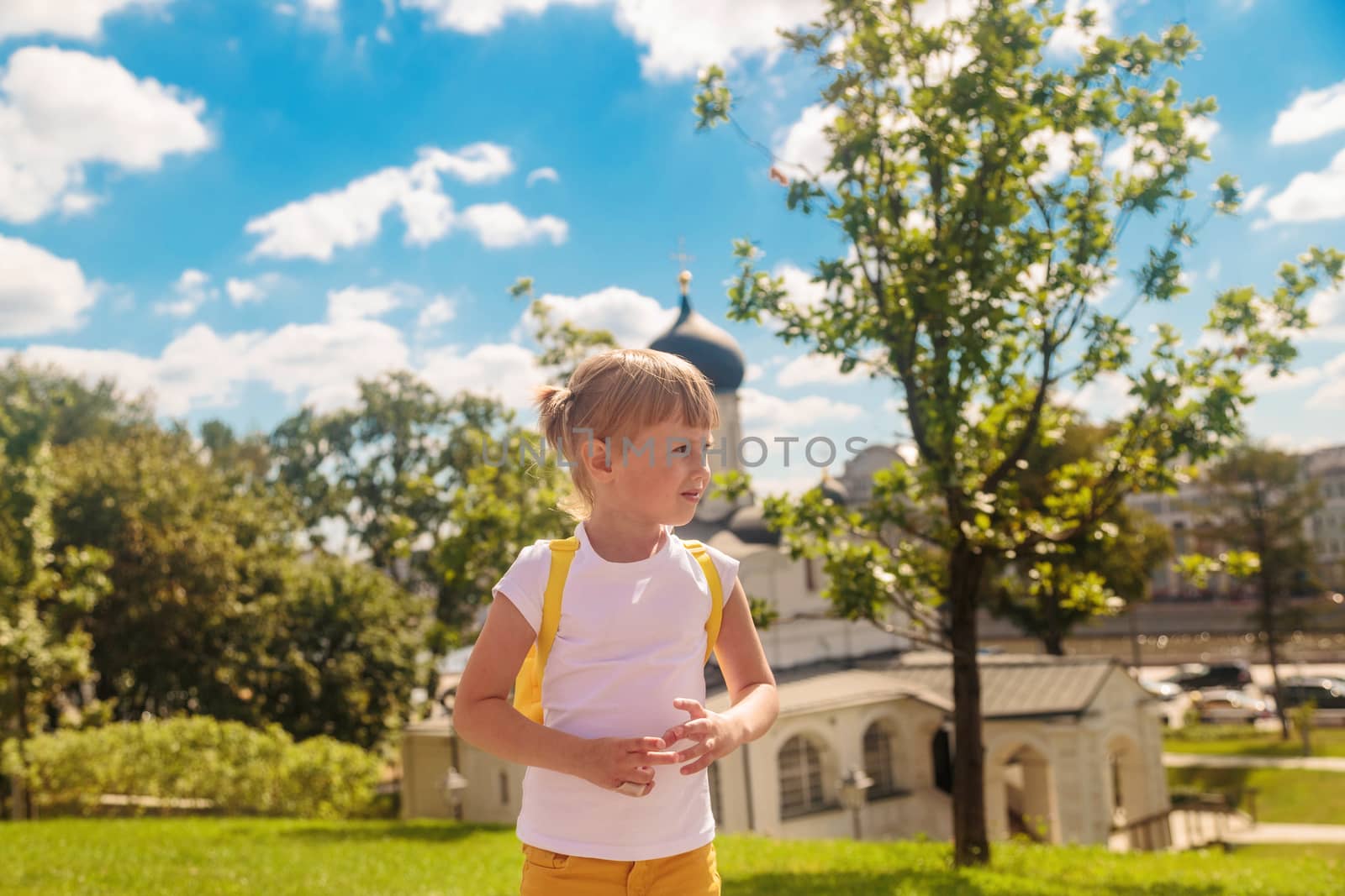 The girl looks to the side against the background of Zaryadye park by galinasharapova