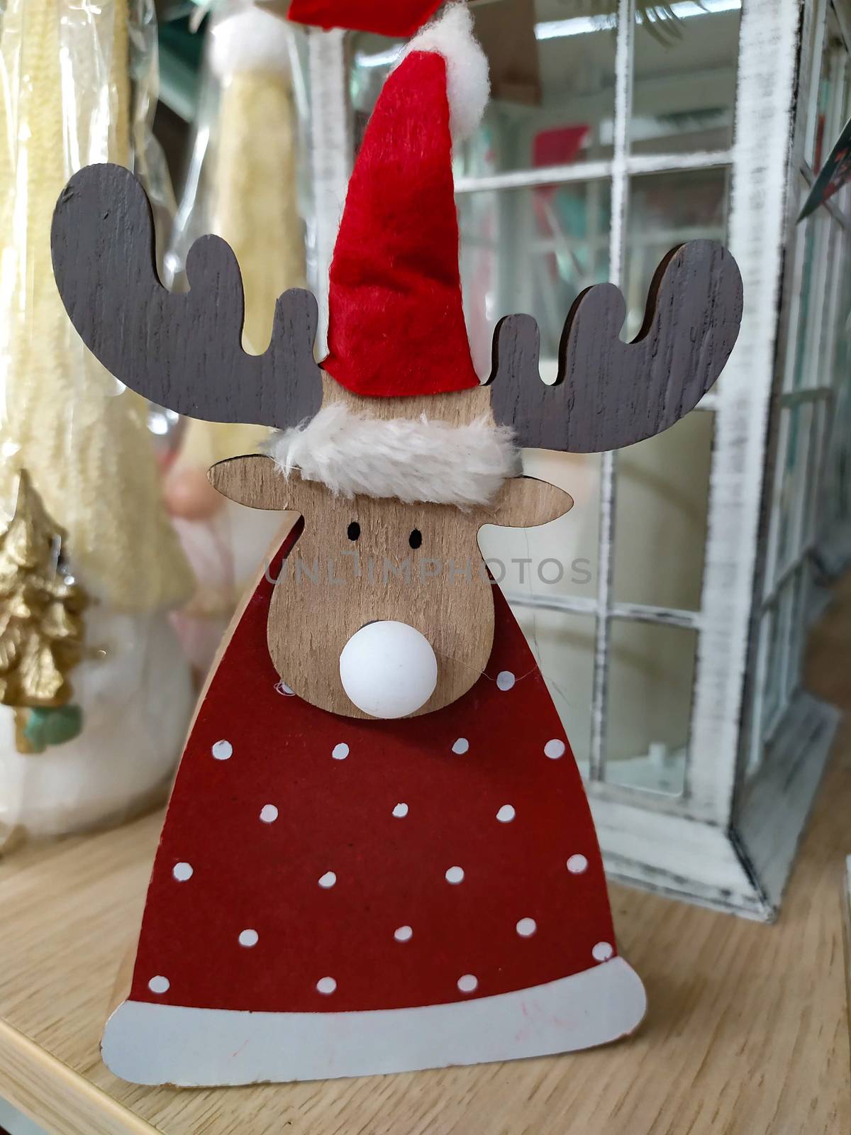 Christmas decorations in a shop, items on sale for the holidays by brambillasimone