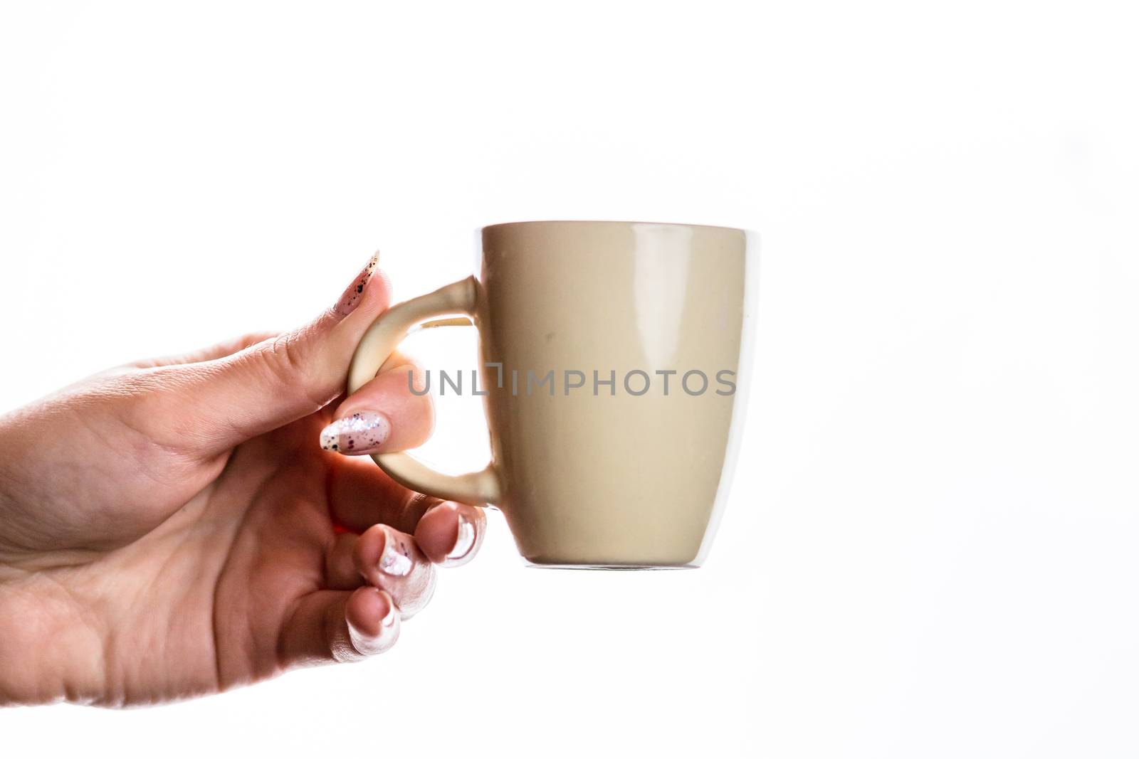 Woman hand holding a cup isolated on white background. by vladispas