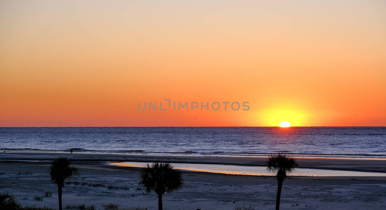 Early Morning Sun Over Empty Beach