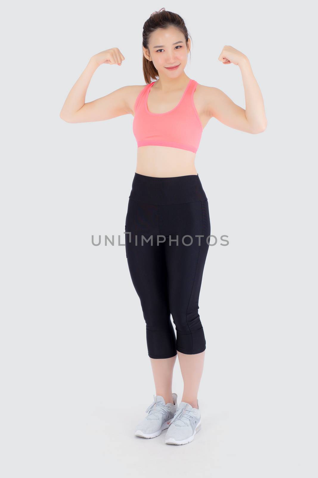 Beautiful portrait young asian woman wear sport clothes have strong and muscle with health, girl show biceps with exercise and workout for wellness isolated on white background, strength and fit concept.