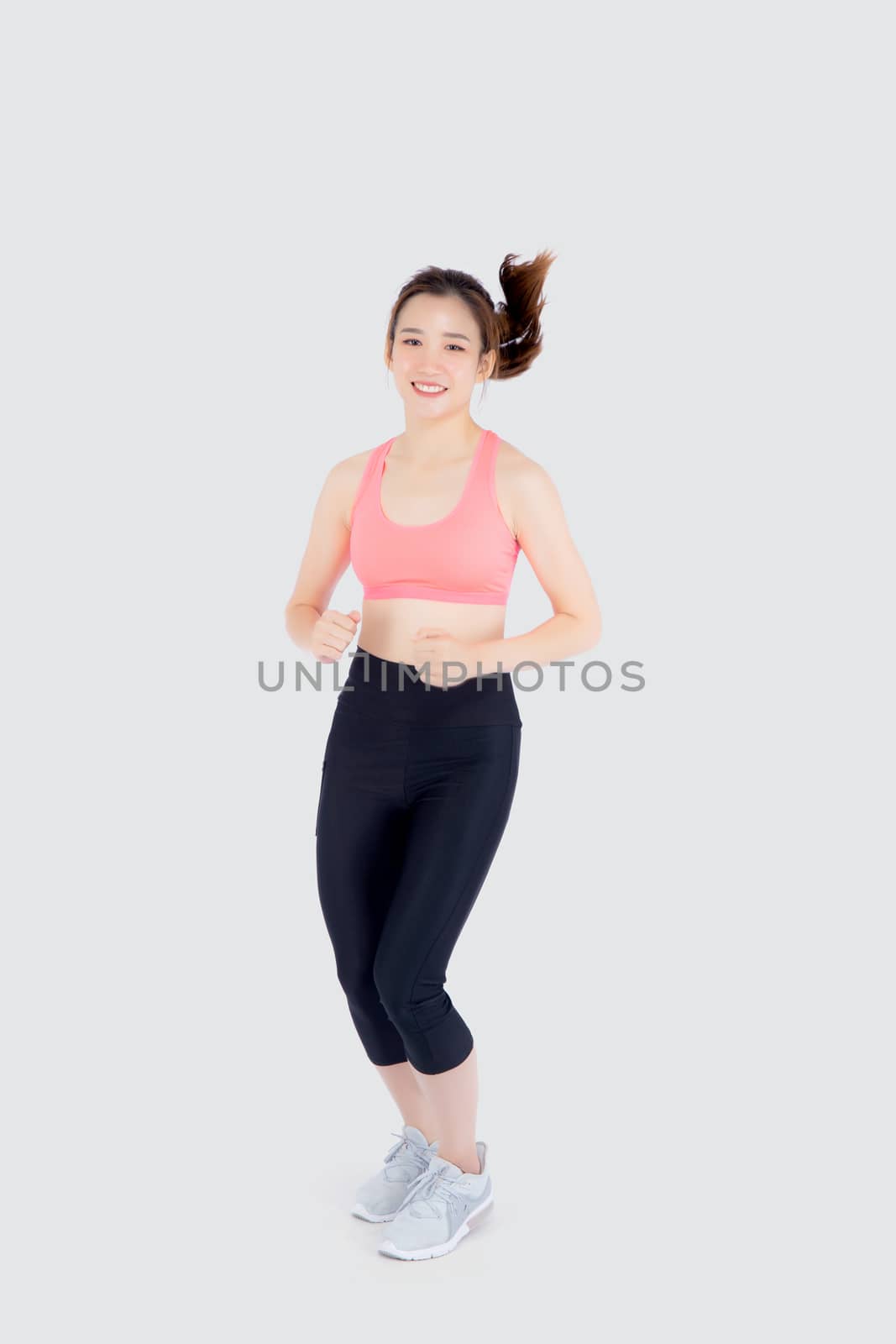 Beautiful young asian woman happy and smiling jogging isolated on white background, asia girl cheerful in sport is activity exercise cardio and workout with running for healthy, health concept.