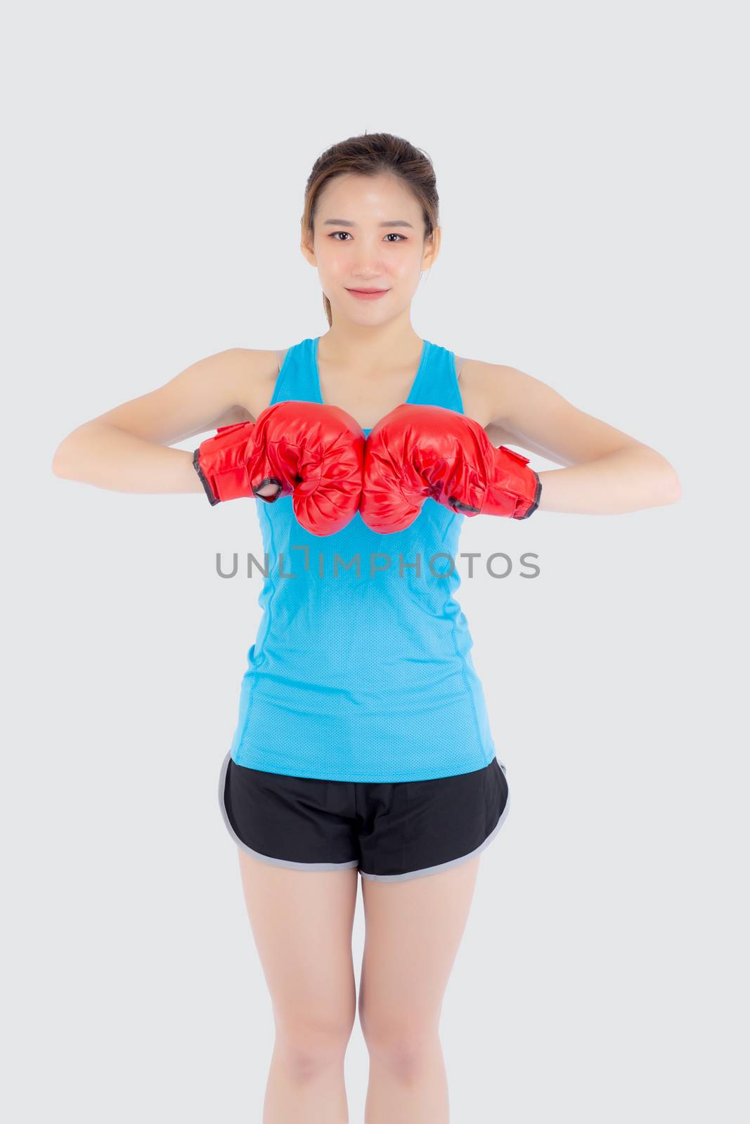 Beautiful portrait young asian woman wearing red boxing gloves w by nnudoo