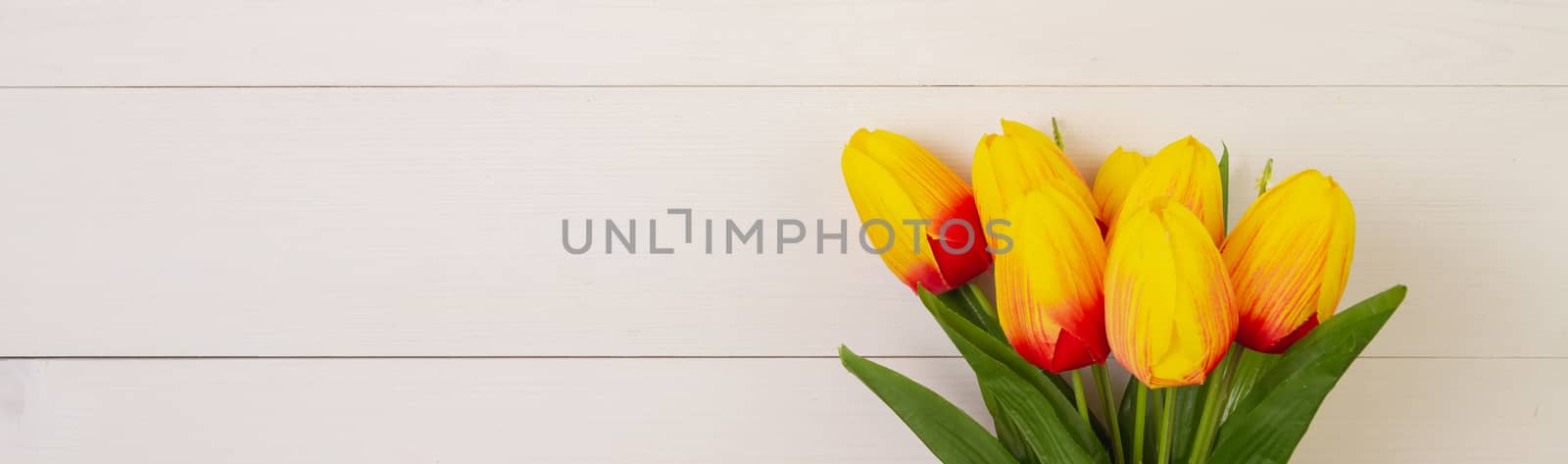 Beautiful tulip flower on wooden background with romantic, mother day or valentine day, spring or summer nature for decoration, bouquet floral for gift on desk, holiday concept, banner website.