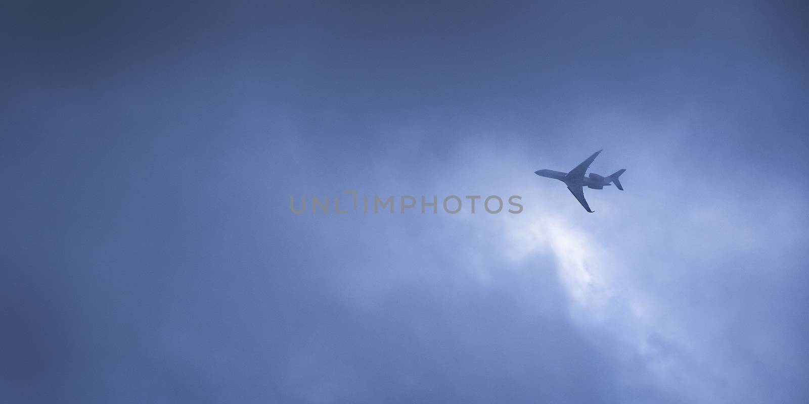 Airplane flying in the strom  by Surasak