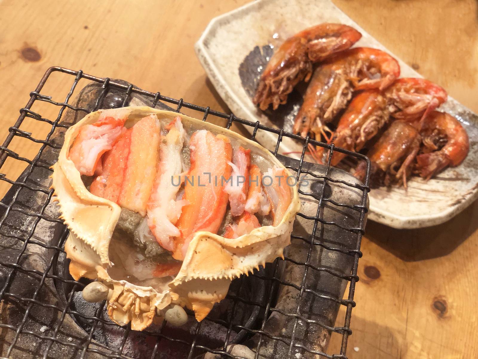 Gril crab brain famous food at tsukiji fish market in tokyo, jap by Surasak