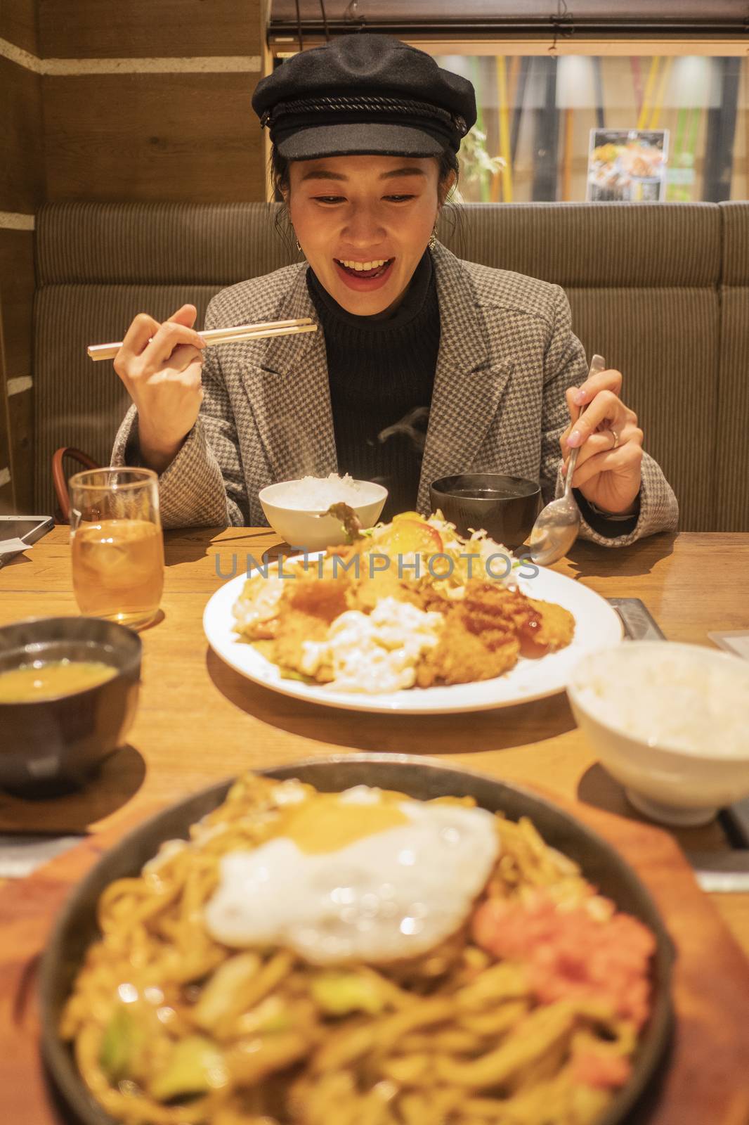 Beautiful asian woman enjoy eating Japanese food in restaurant