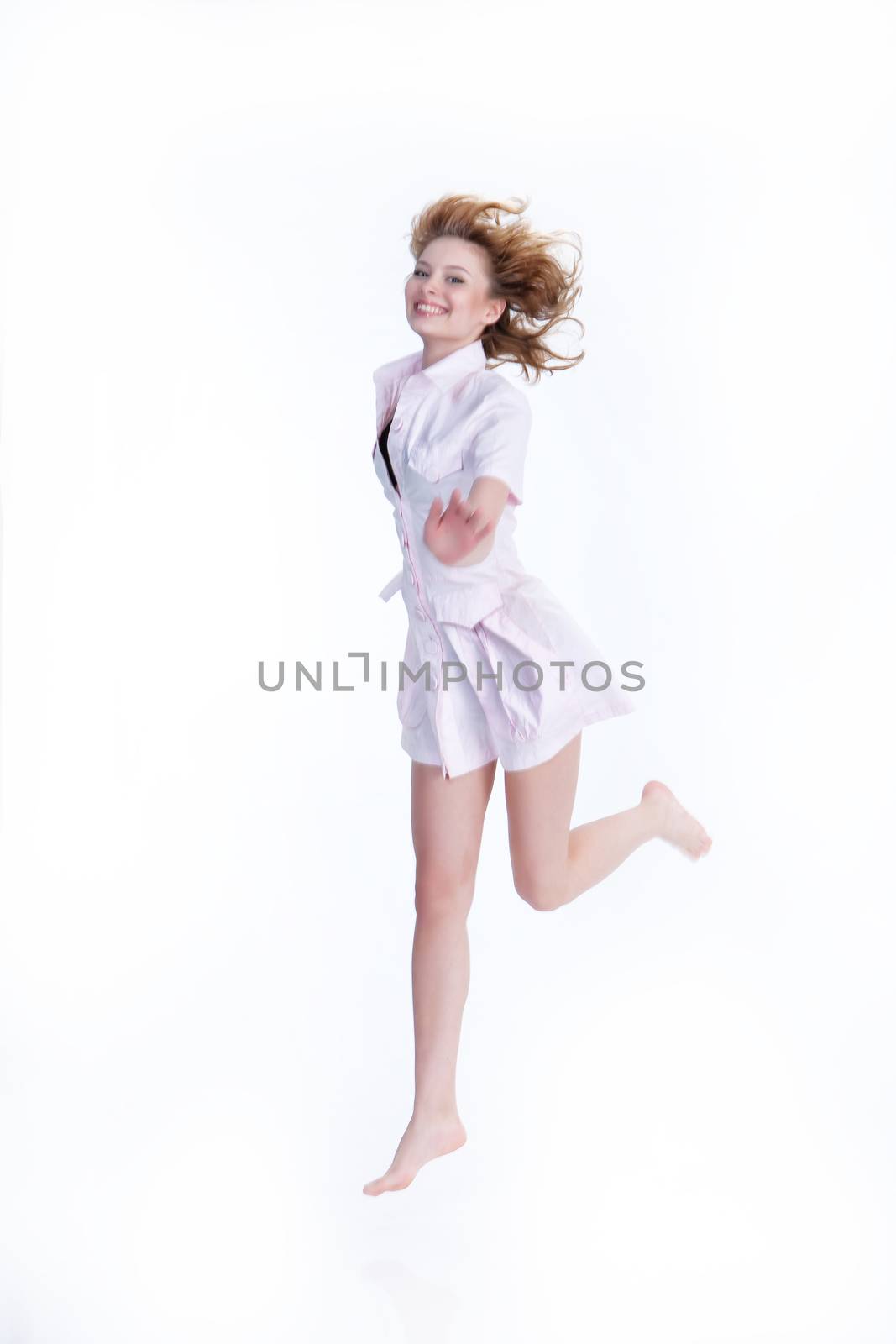 Young woman jumping and laughing