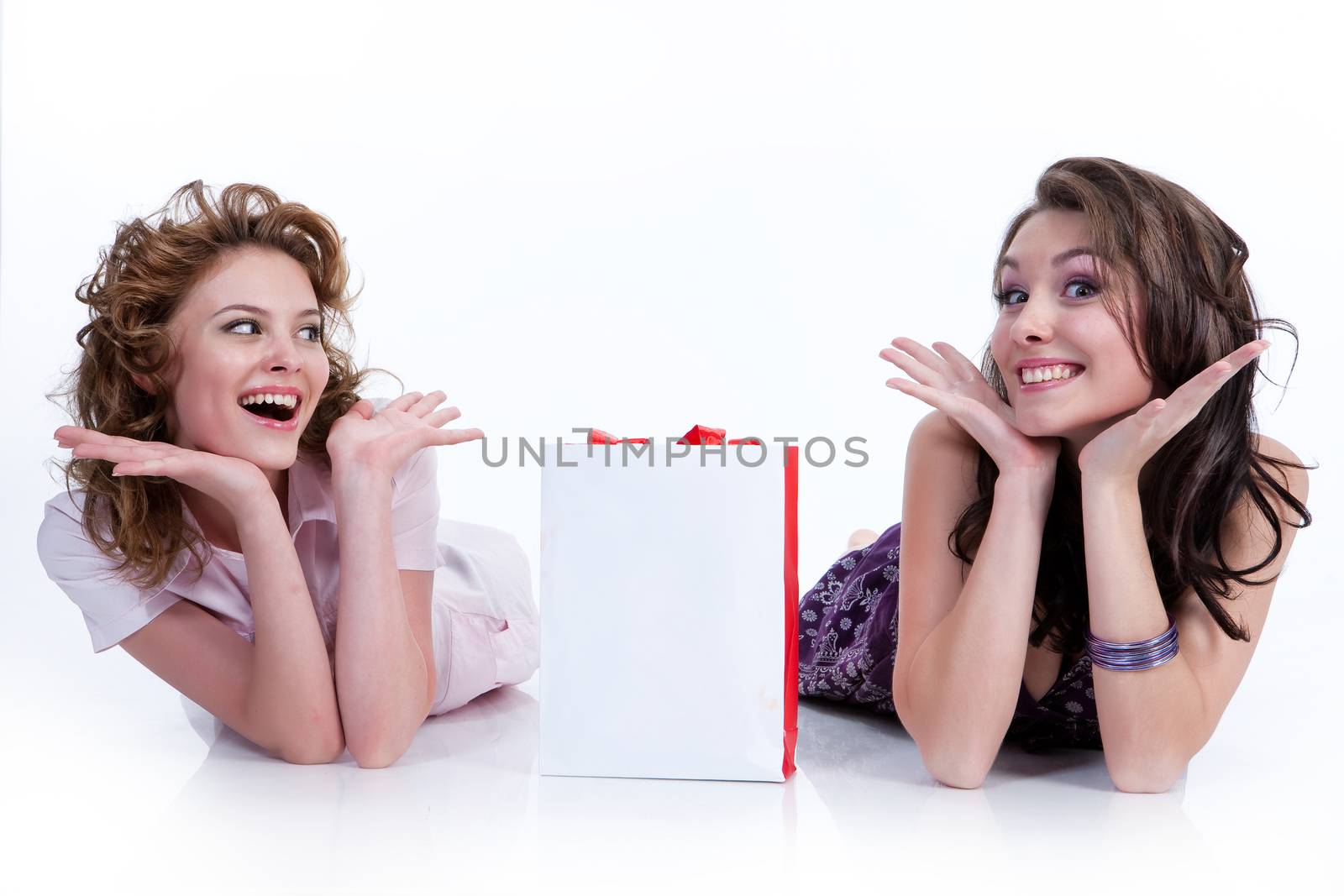 Two young women with shopping bag in different actions and emotions