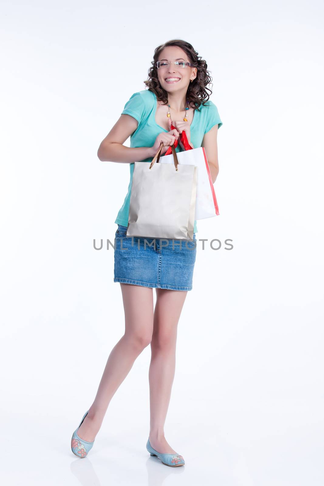 Young woman with shopping bag in different actions and emotions