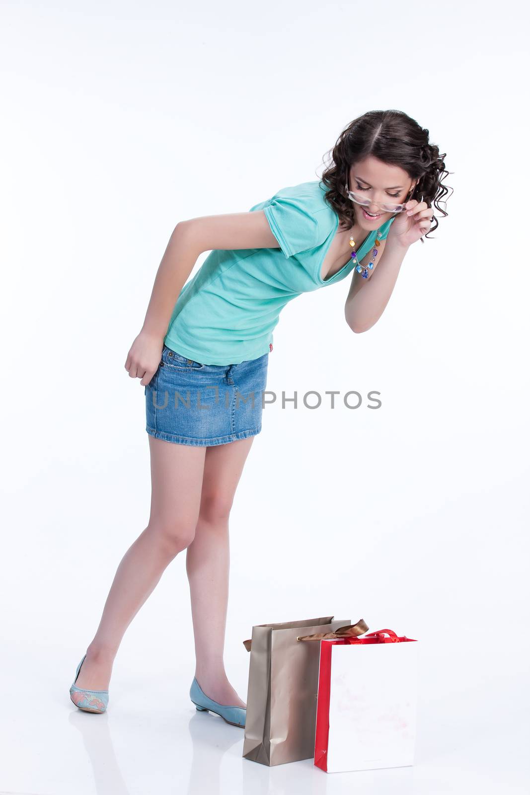 Young woman with shopping bag in different actions and emotions