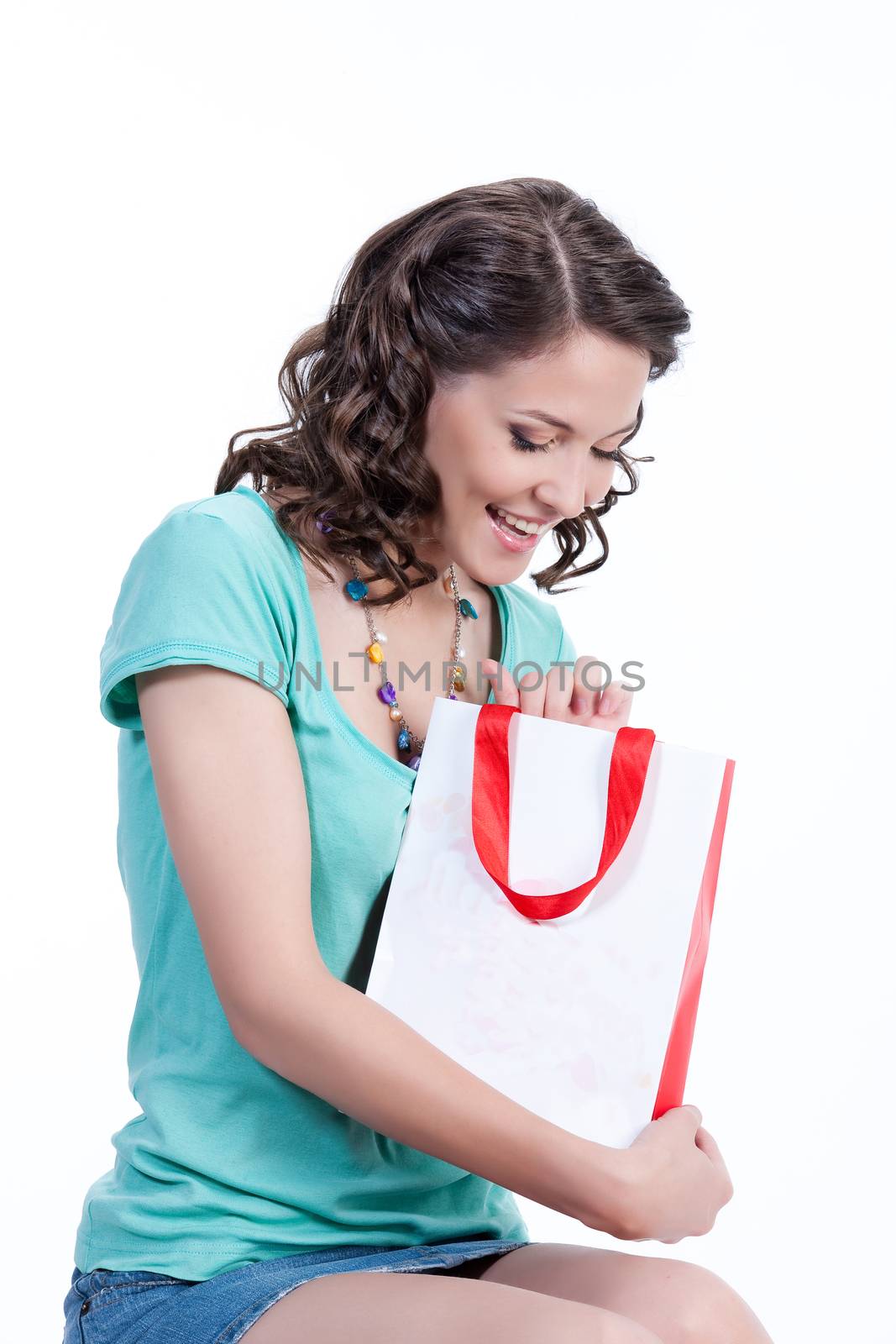 Young woman with shopping bag in different actions and emotions