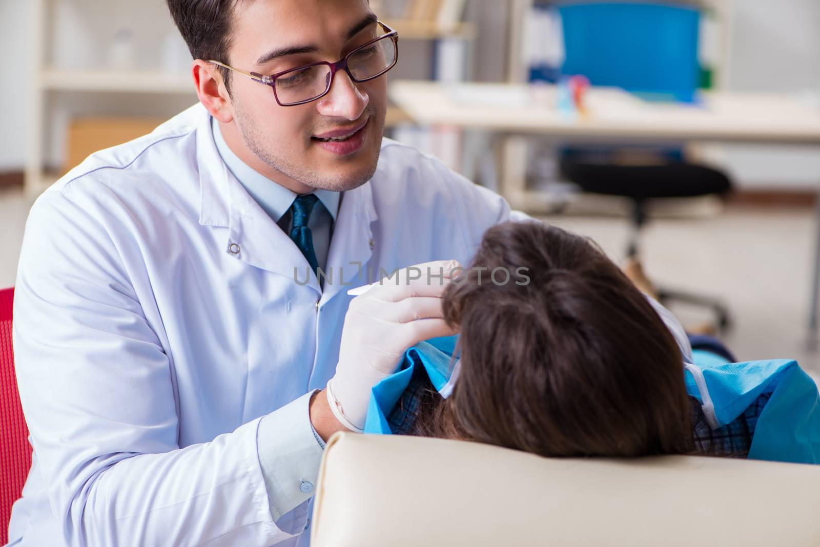 Patient visiting dentist for regular check-up and filling