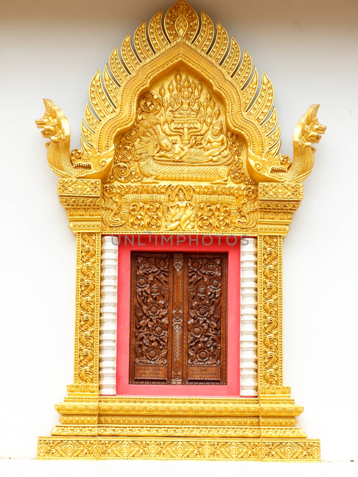 Window  woodcarving in temple by Praphan