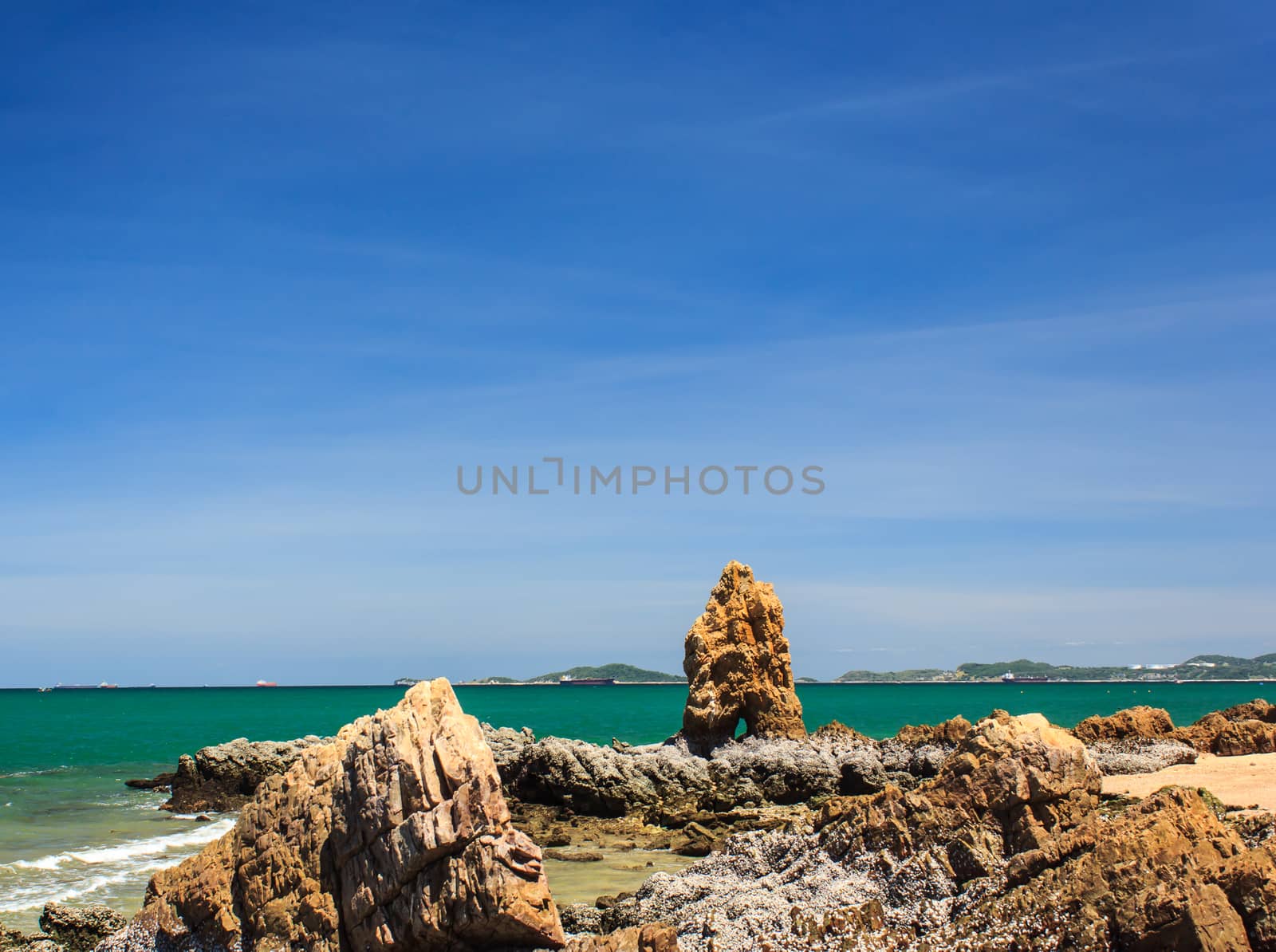 Beautiful sea and rocks daytime.  by Praphan