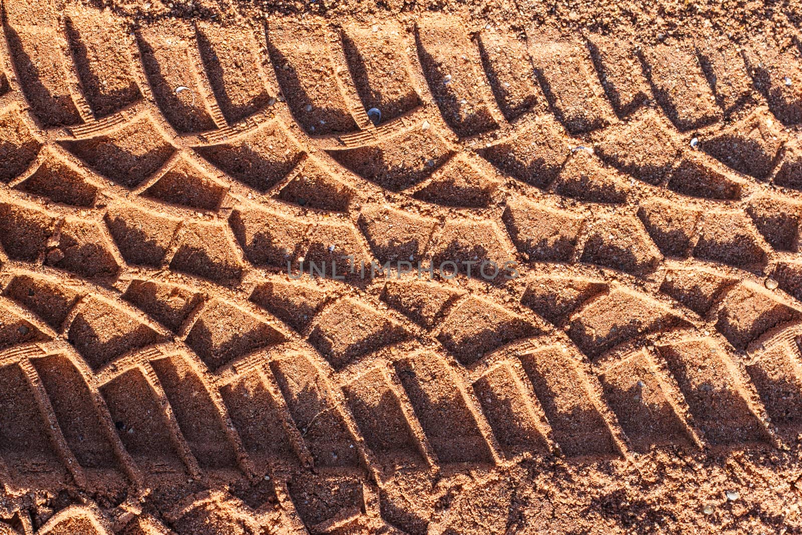Tire track on muddy road  by Praphan