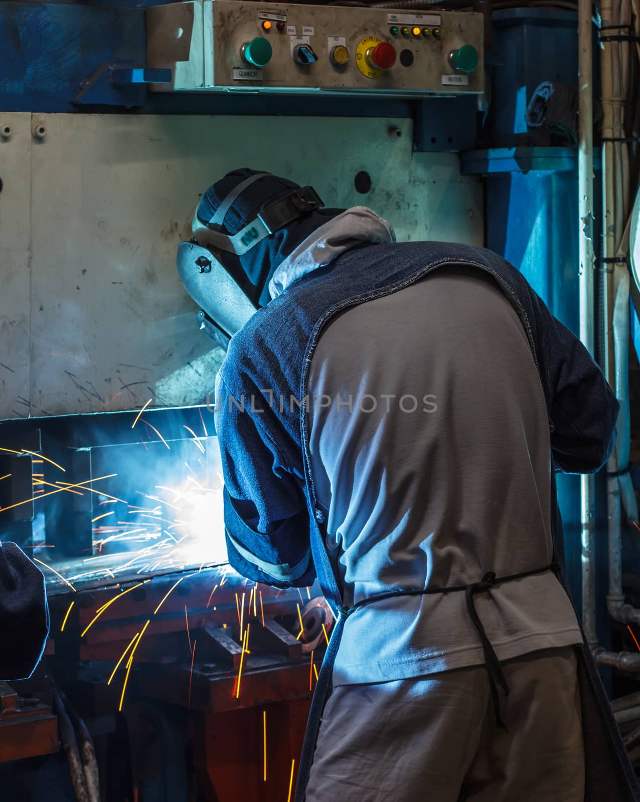 Industrial steel welder in factory