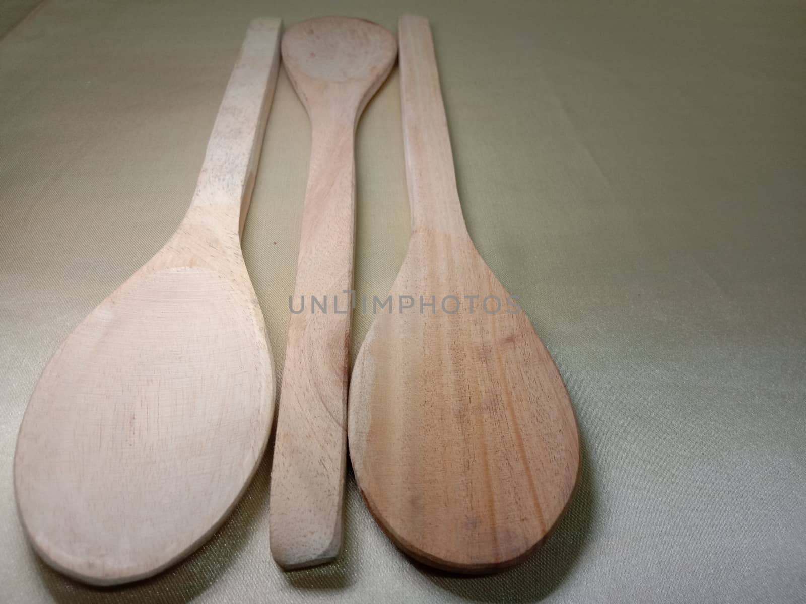 wooden spoon closeup on white background
