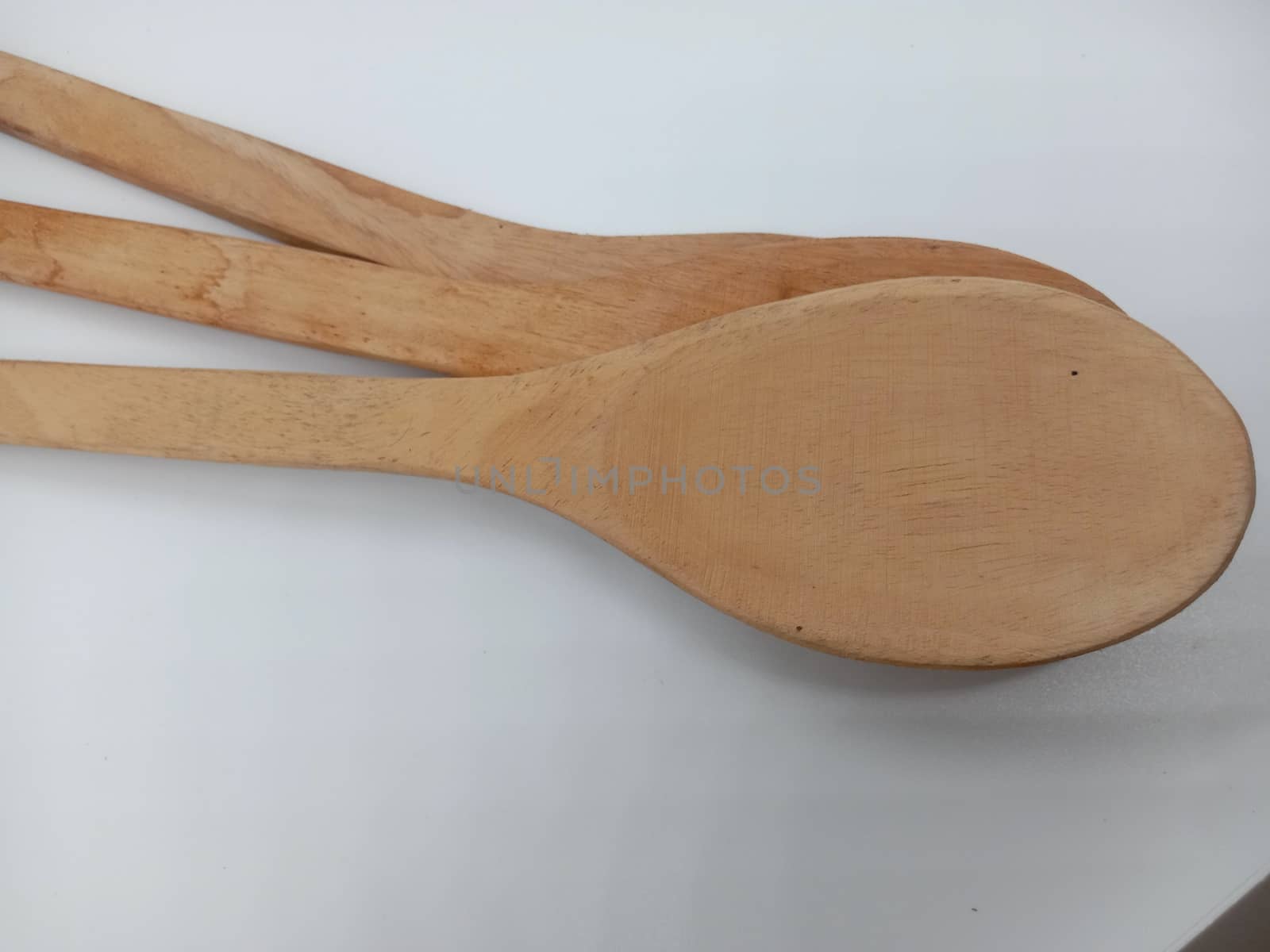 wooden spoon closeup on white background