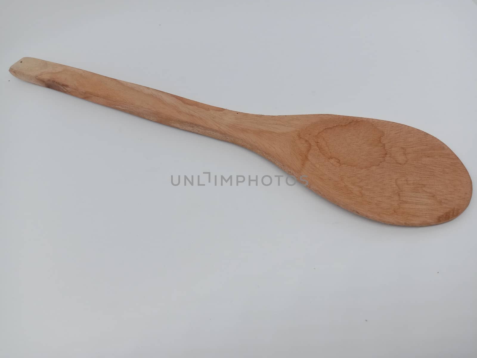 wooden spoon closeup on white background