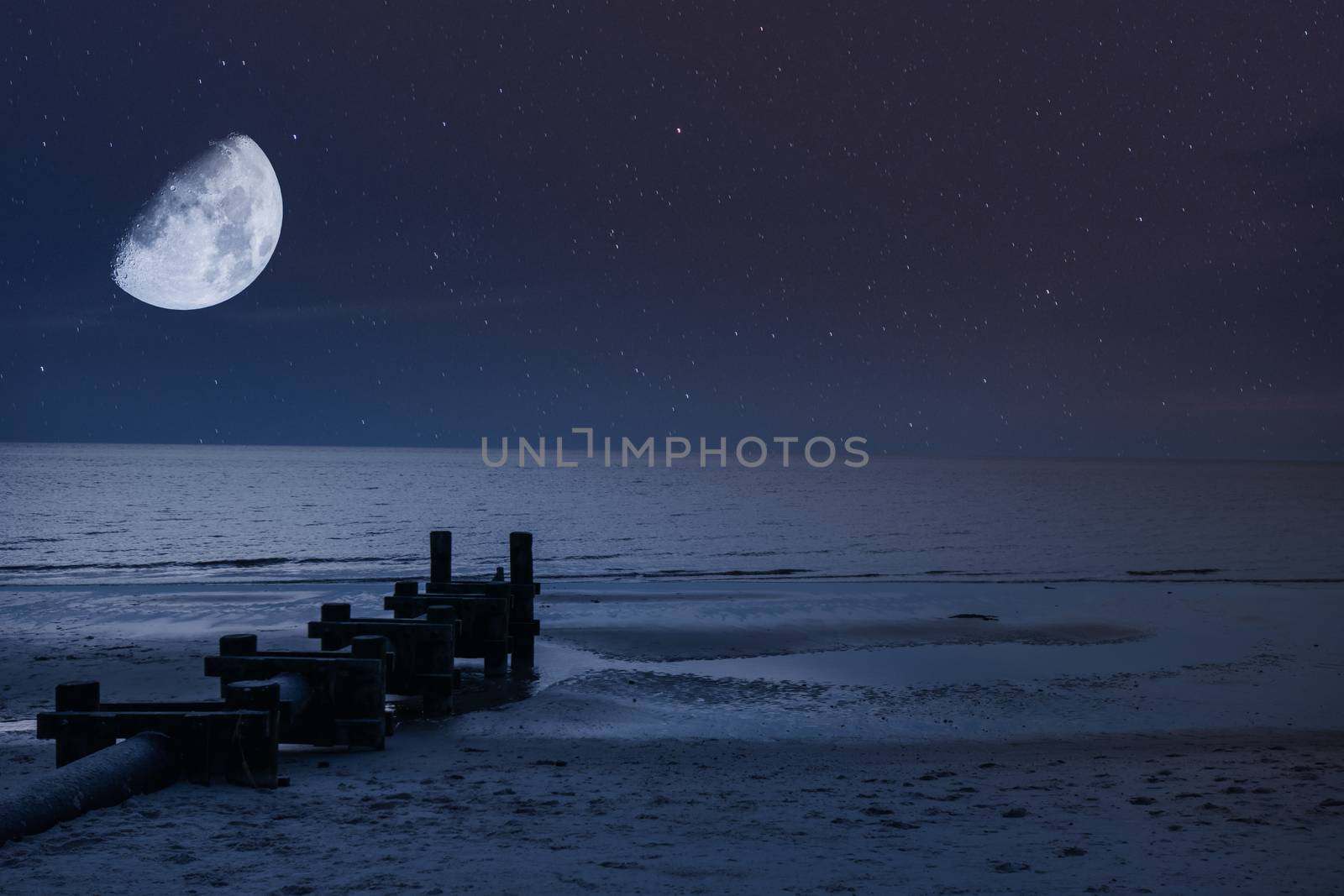A Half Moon and Stars Over the Beach and Ocean at Night With a P by bju12290