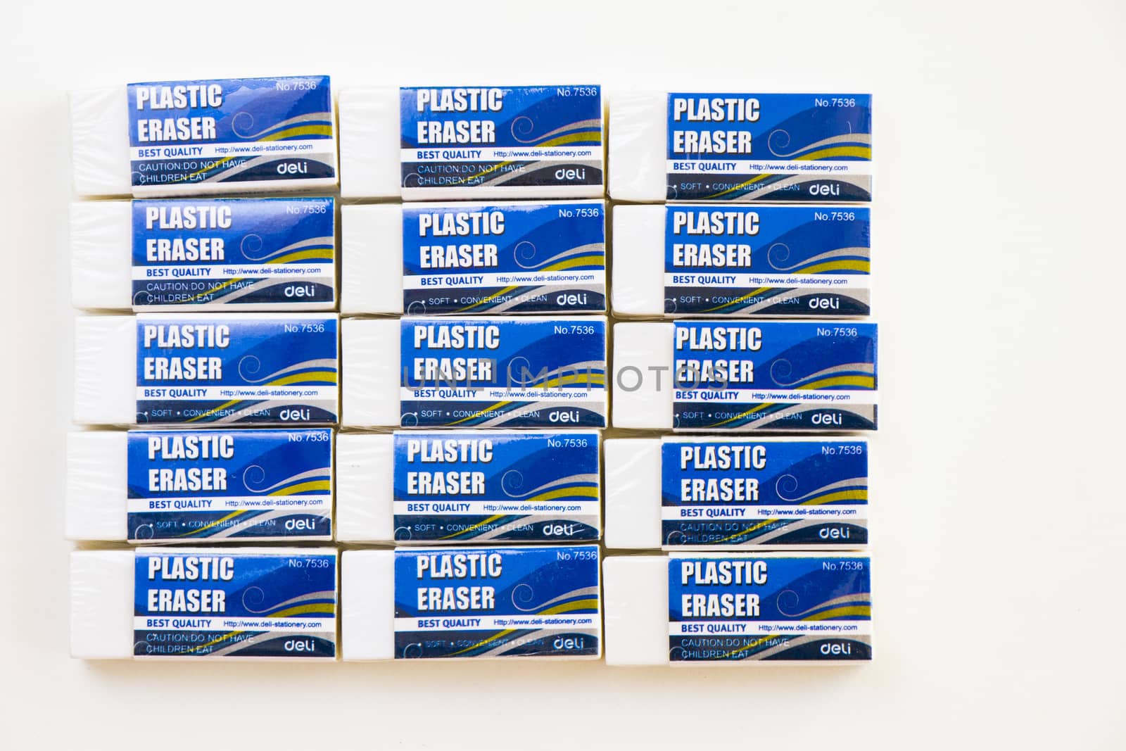 Deli plastic erasers on the white background by Taidundua