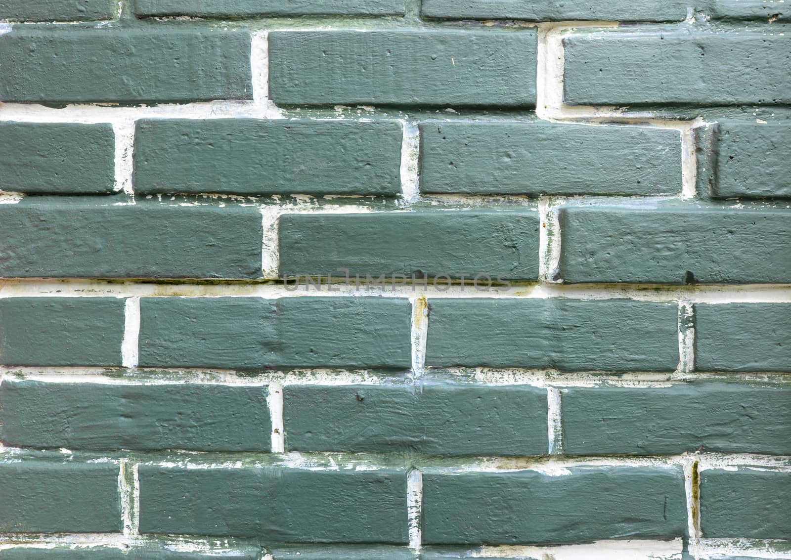 Green textured brick wall background. Loft style.