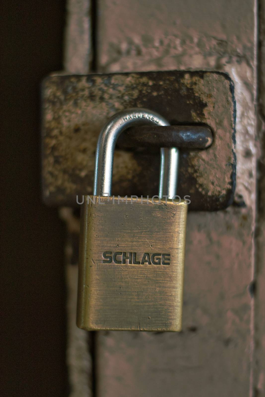 San Francisco, United States, November 2013: Illustrative Editorial: Schlage hardened weathered lock holding a door closed