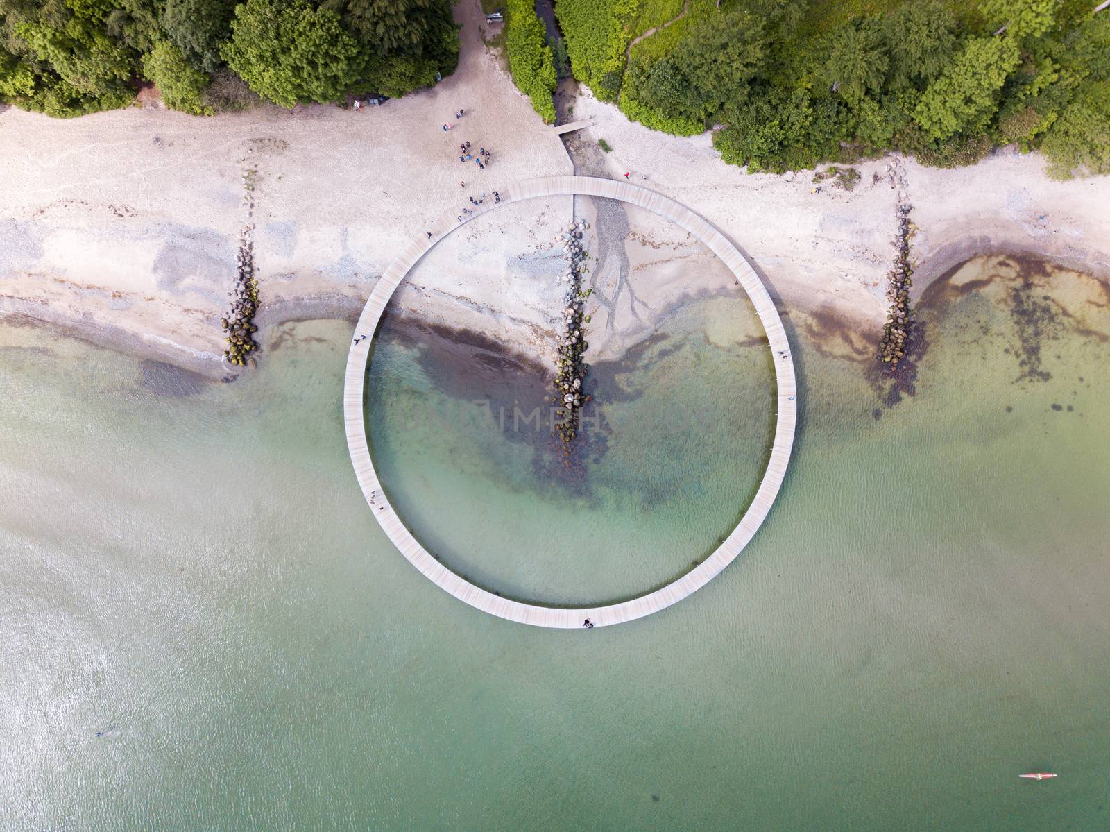 Aarhus, Denmark - June 9, 2019: Aerial drone view of the Infinity Bridge, a work of art by architect Niels Povlsgaard and Johan Gjoedes.