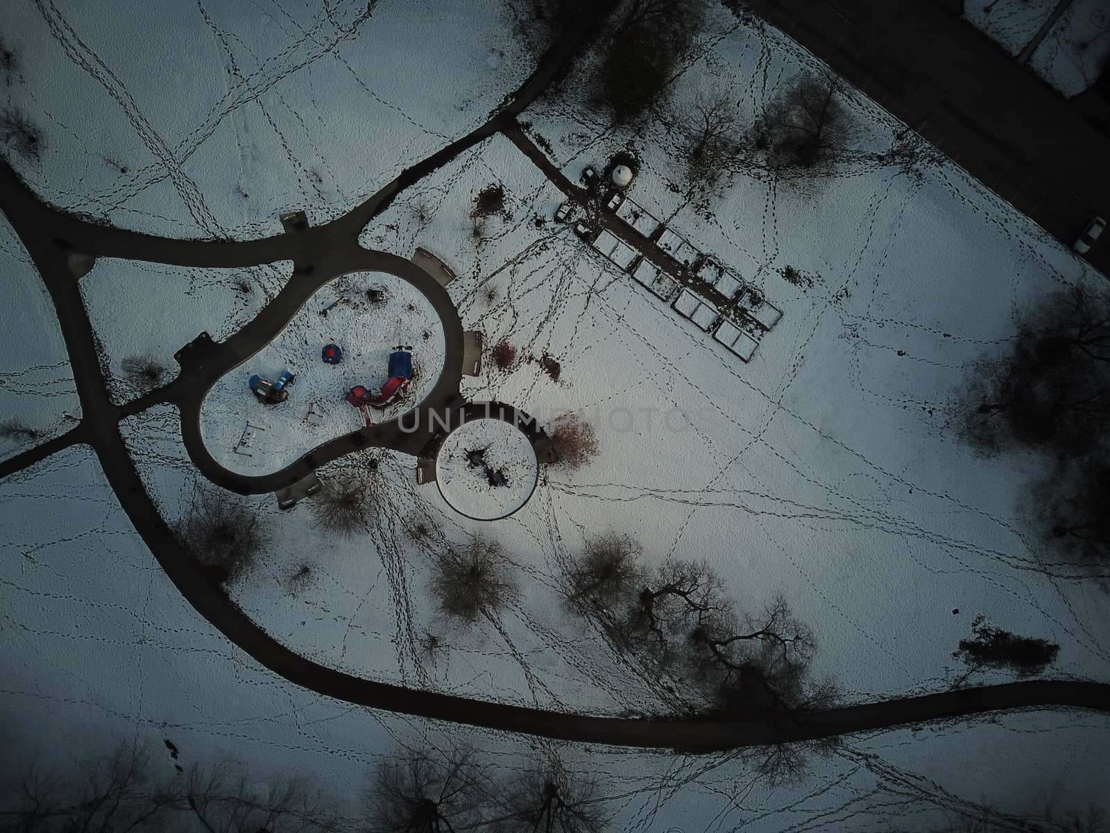 aerial view of a winter park with lots of trails and a playground by mynewturtle1