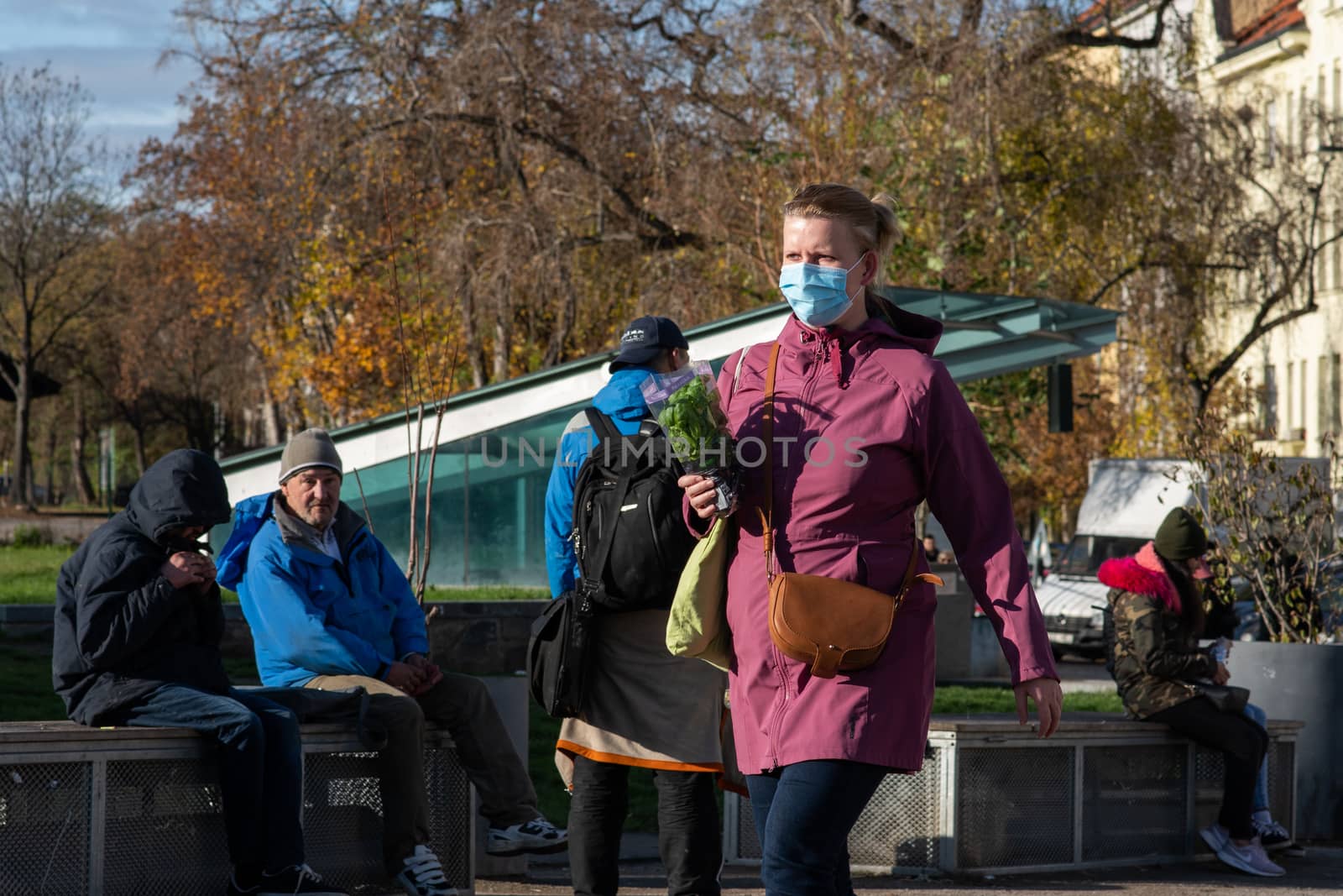 11/20/2020. Prague, Czech Republic. People during quarantine period due to coronavirus at Hradcanska metro stop in Prague. Woman is walking.