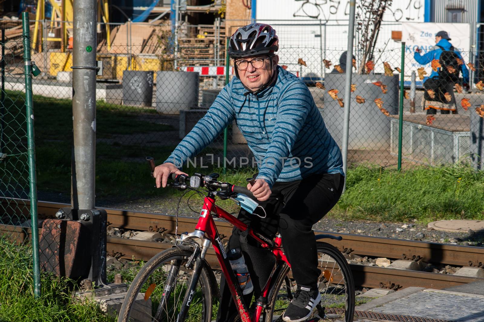 11/20/2020. Prague, Czech Republic. People during quarantine period due to coronavirus at Hradcanska metro stop in Prague. Man biking.