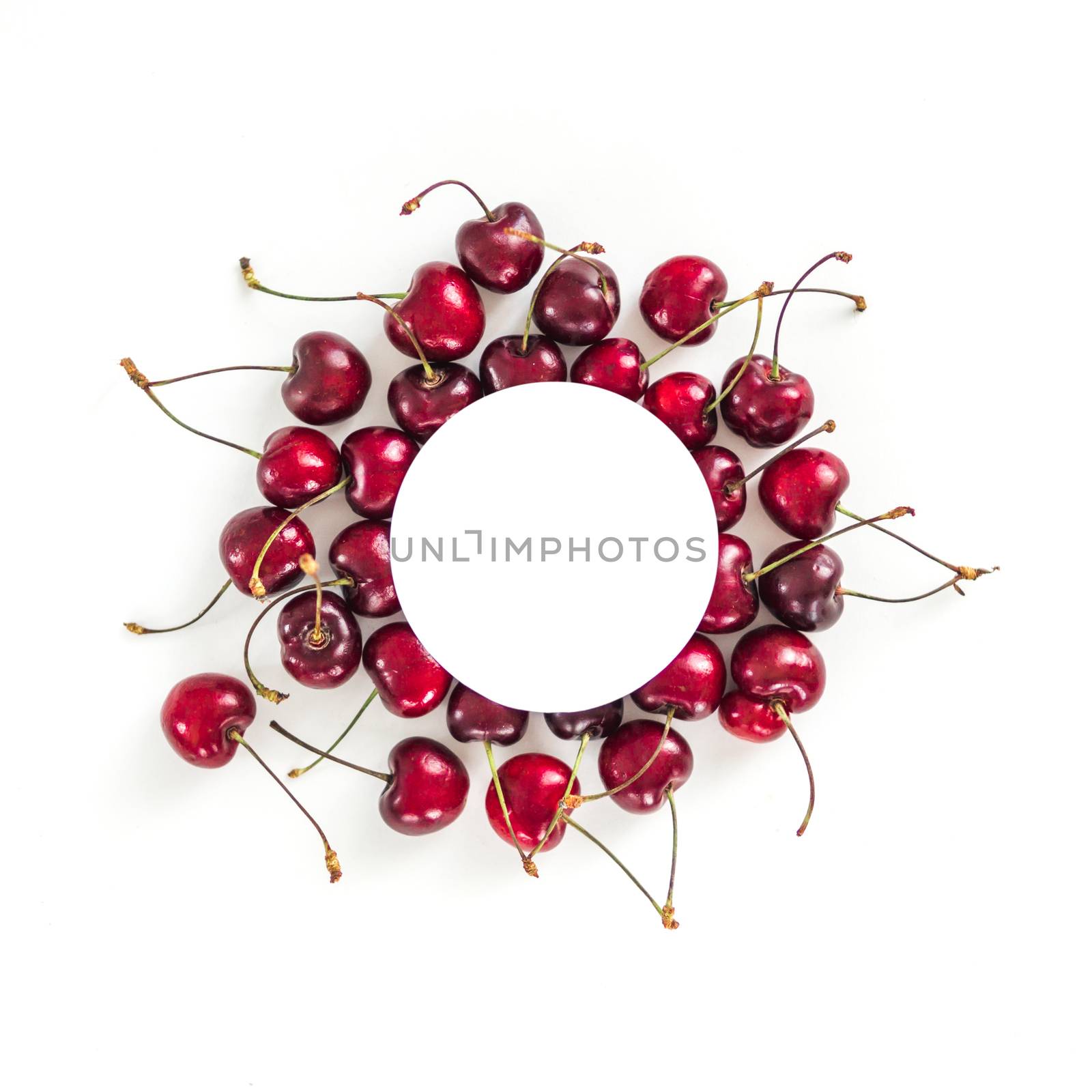 Creative layout with fresh ripe berries. cherry isolated on white background with white circle for copy space. Can use for your design, promo, social media, Top view. Instagram format square.