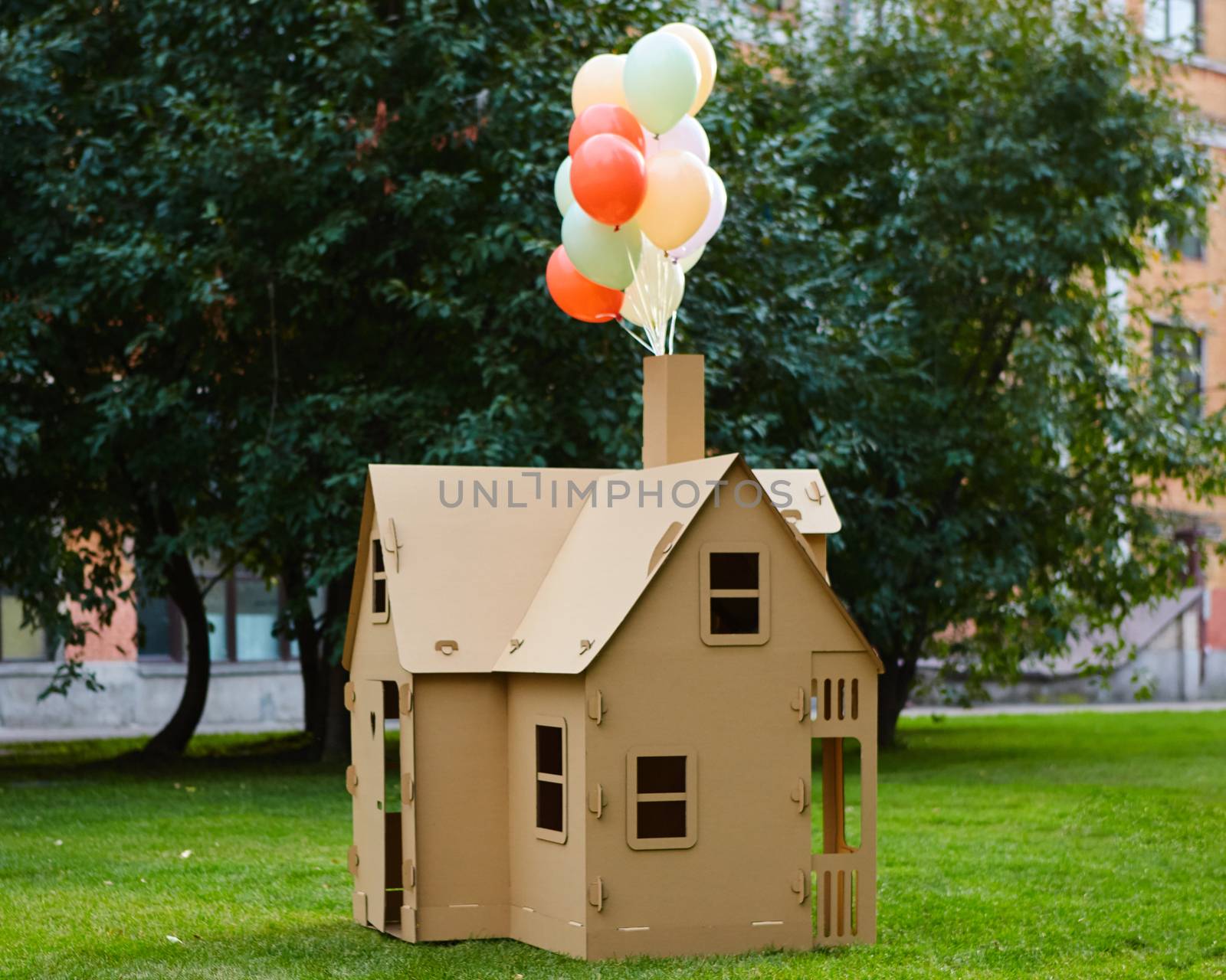 Cardboard playhouse in the backyard for kids. Eco concept.