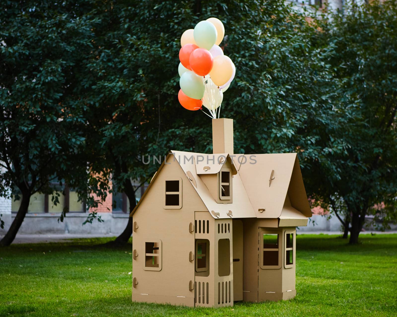 Cardboard playhouse in the backyard for kids. Eco concept by sarymsakov