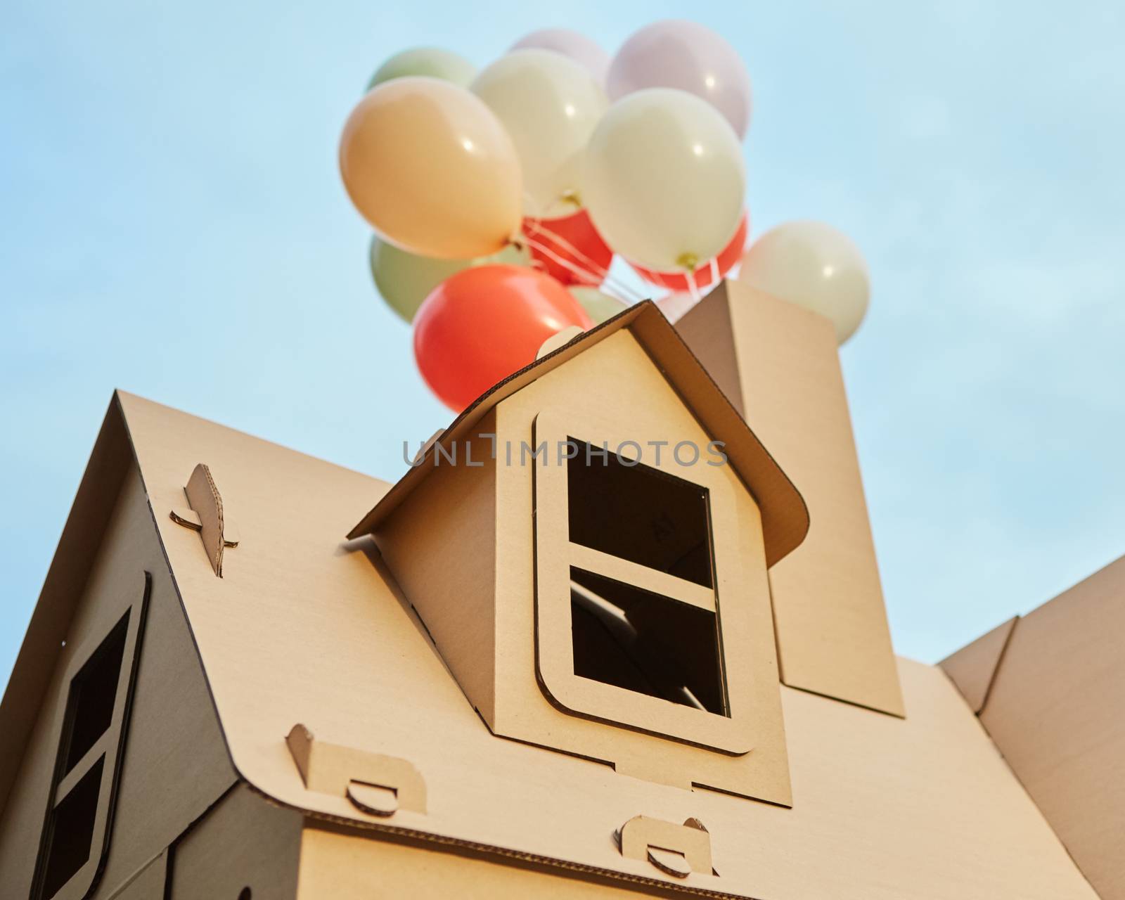 Cardboard playhouse in the backyard for kids. Eco concept.