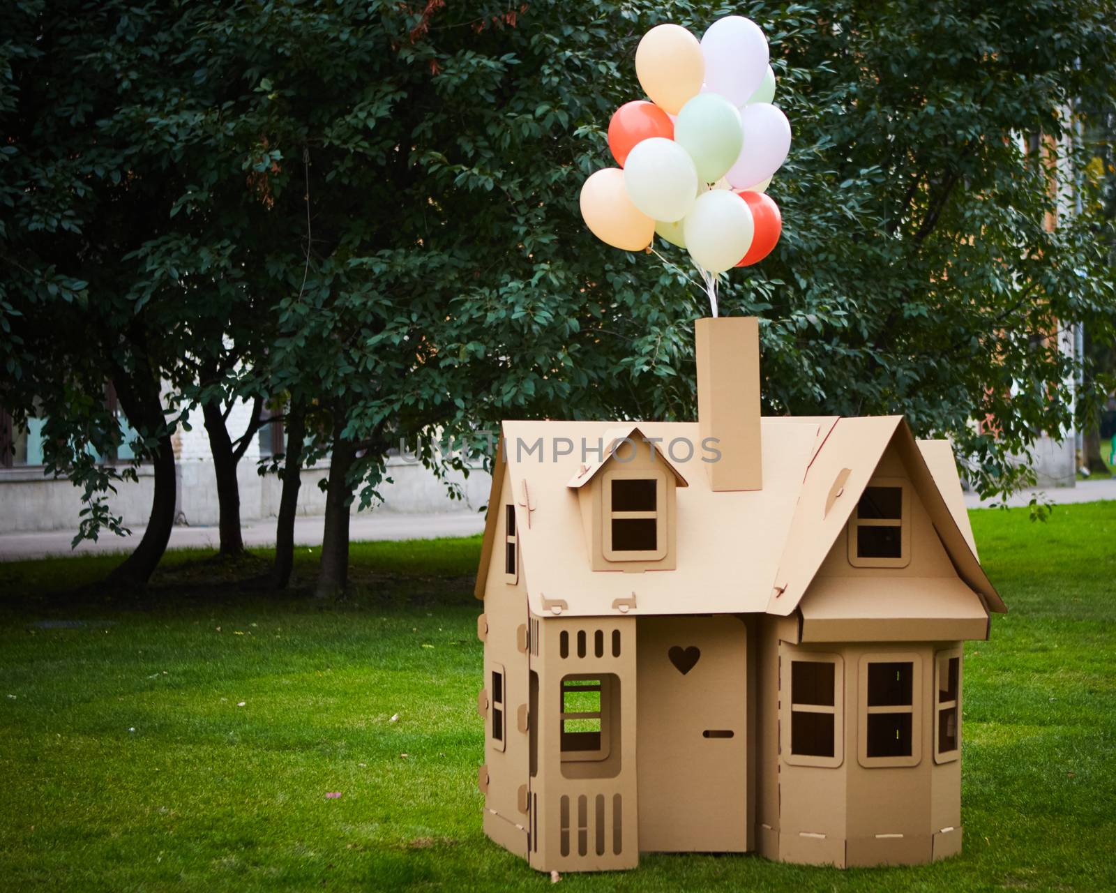 Cardboard playhouse in the backyard for kids. Eco concept.