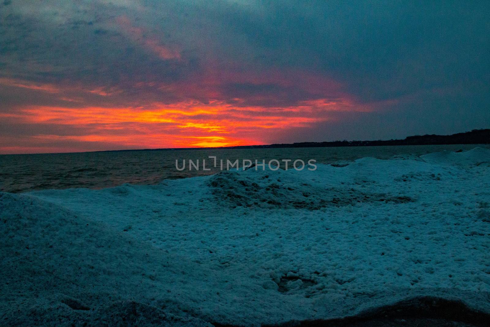 dramatic sunset at Port Stanley beach in the winter in Canada by mynewturtle1