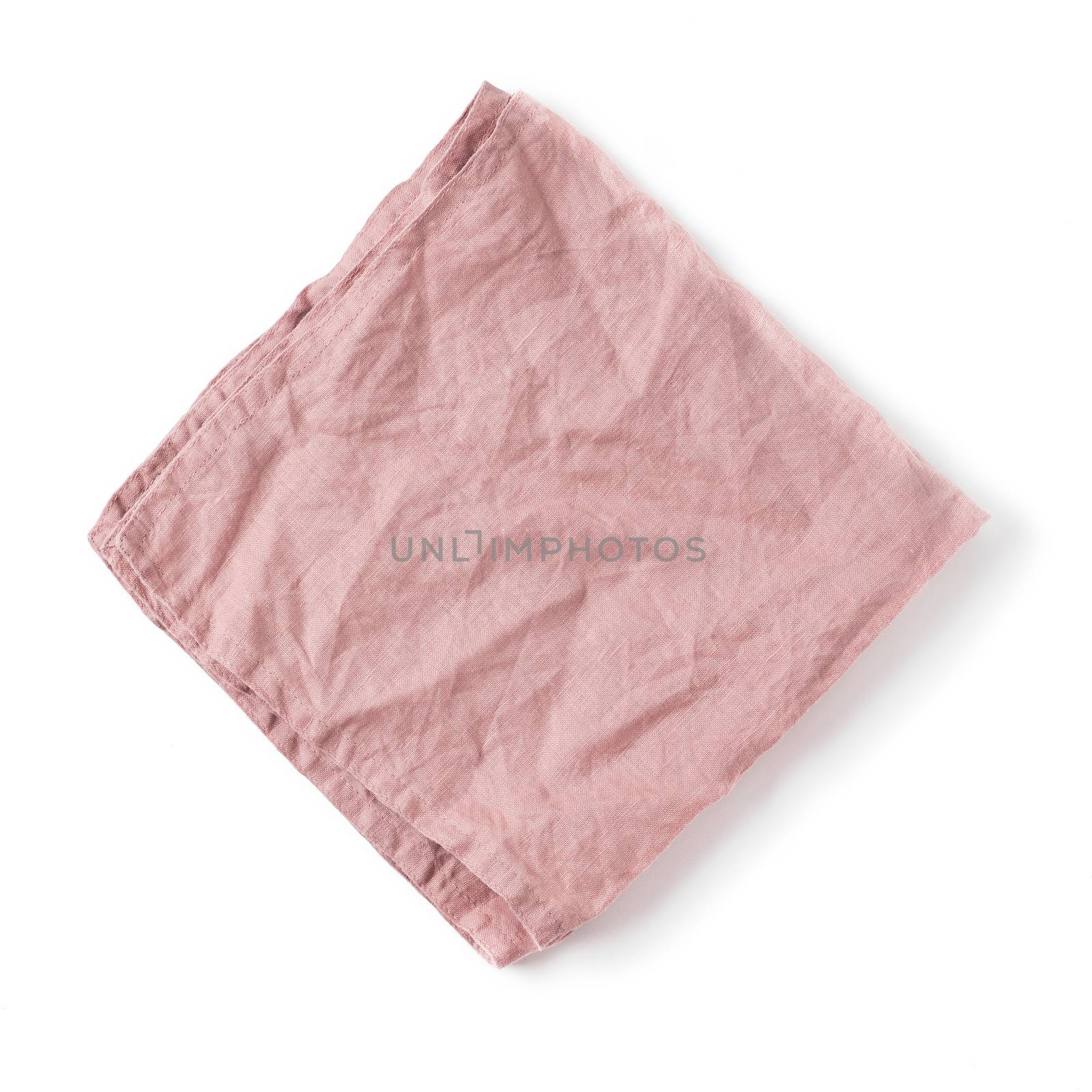 Folded old rose color linen napkin isolated on white background. obscure pink linen napkin. Isolated on white with clipping path. Top view or flat lay.